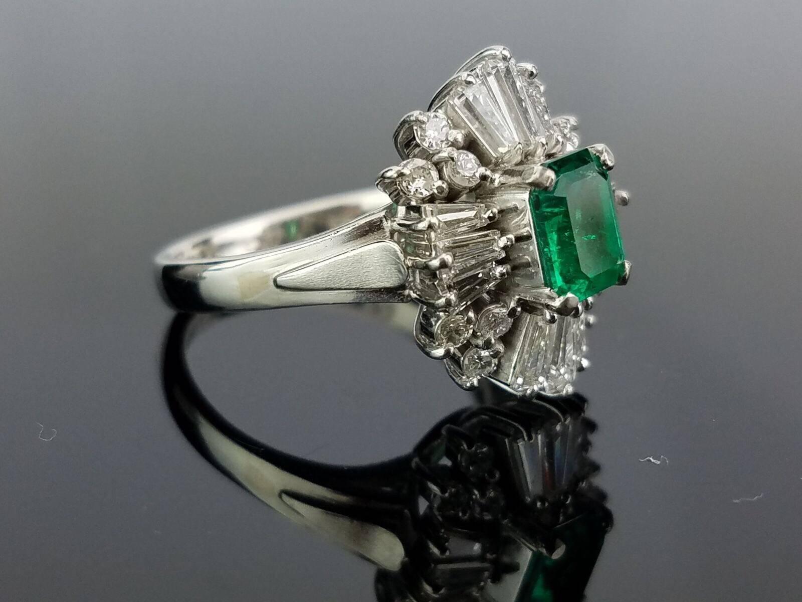 Stone Details: 
Stone: Colombian Emerald
Cut: Emerald cut
Carat Weight: 0.7 Carat

Diamond Details:
Cut: Brilliant / Baguette
Total Carat Weight: 1.07 carat
Quality: VS/SI , H/I

Platinum 900: 7.83 grams 

Can provide certificate upon request. 
Can