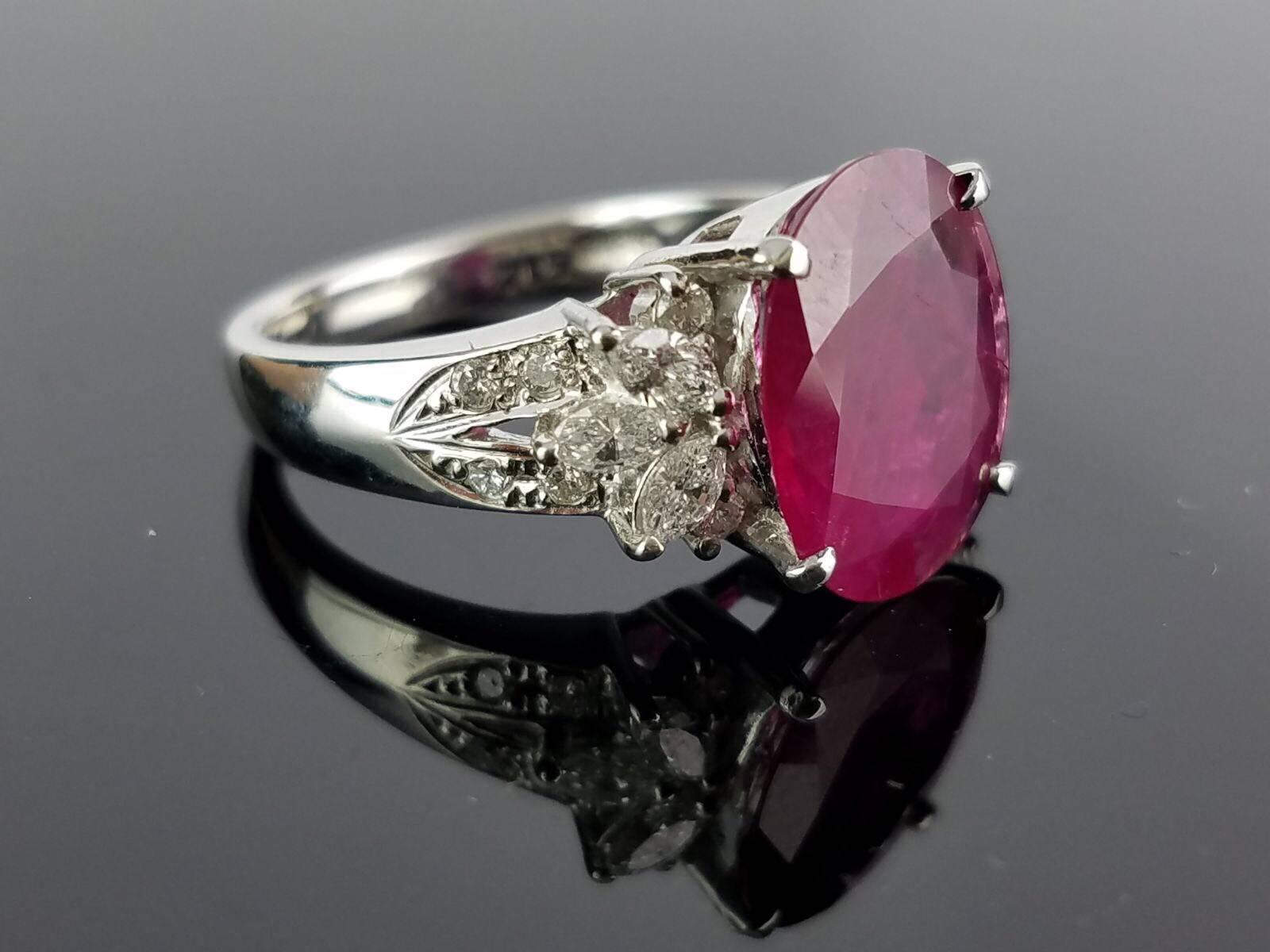 A statement Burmese Ruby and White Diamond cocktail ring, all set in Platinum.

Stone Details: 
Stone: Burmese Ruby 
Carat Weight: 3.12 Carat

Diamond Details:
Total Carat Weight: 0.48 carat
Quality: VS/SI , H/I

Platinum 900: 6.88 grams 

The ring