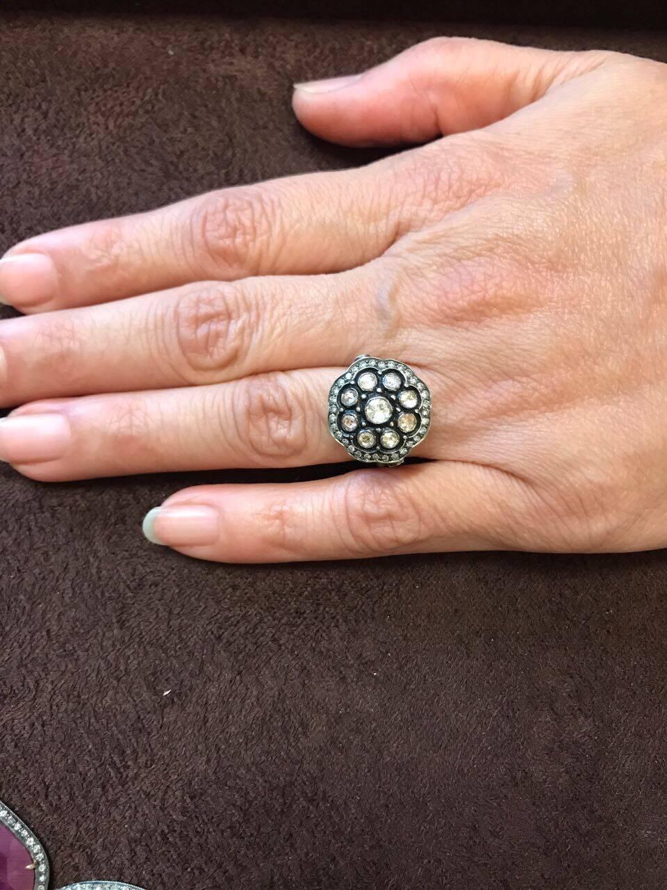 Gorgeous handmade, antique looking cocktail ring, with rose cut and single cut diamonds embedded in silver and gold. The ring can be resized as required.

Diamond Details:
Total Carat Weight: 0.83 carat
Quality: VS/SI , H/I

Gold and Silver Weight: