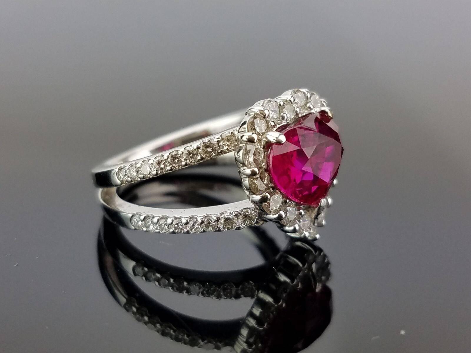 Beautiful cocktail ring, with a lustrous 3.02 carat heart shaped Burmese Ruby with White Diamond cocktail ring, all set in a white Platinum band. 

Stone Details: 
Stone: Burmese Ruby 
Carat Weight: 3.02 Carat

Diamond Details:
Total Carat Weight:
