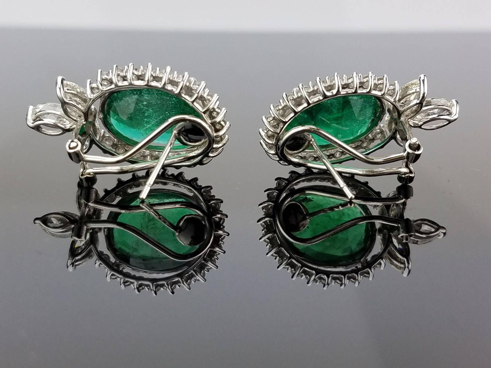 A very elegant pair of earrings, using high-quality Zambian Emerald of beautiful colour and White Diamond, all set in 18K white gold. 

Stone Details: 
Stone: Zambian Emerald
Carat Weight: 15.91 Carat

Diamond Details: (marquise and brilliant
