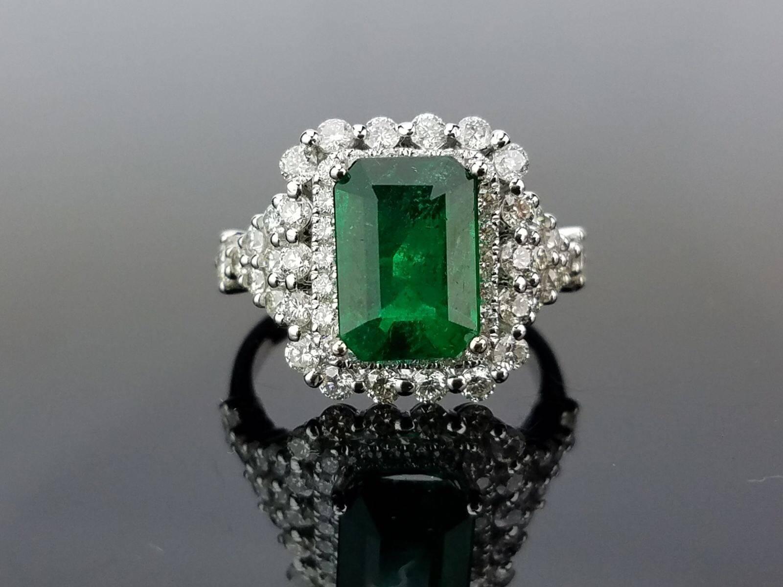A beautifully created cocktail ring, using white diamonds and fine quality emerald all set in 18K white gold. 

Stone Details: 
Stone: Emerald
Carat Weight: 2.97 Carat

Diamond Details:
Total Carat Weight: 1.365 carat
Quality: VS/SI , H/I

18K Gold:
