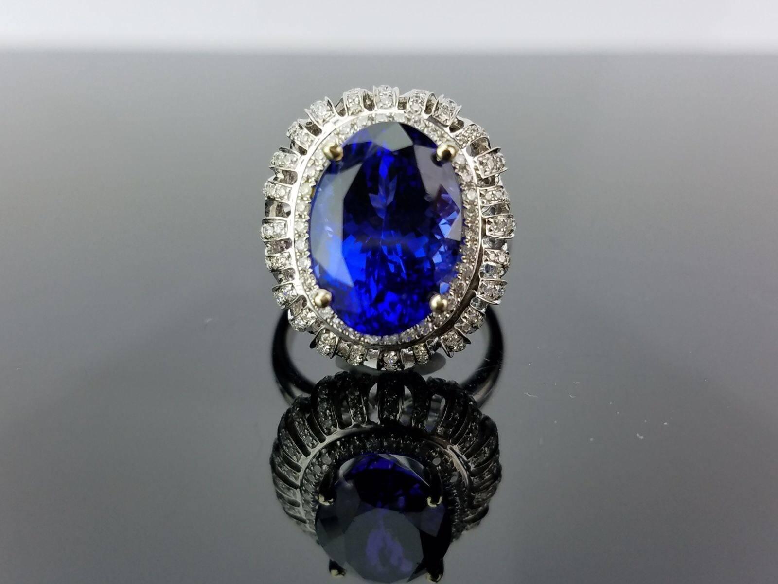A beautiful oval Tanzanite without any inclusions and White Diamond cocktail ring, all set 18K white gold. 

Stone Details: 
Stone: Tanzanite
Carat Weight: 10.78 Carat

Diamond Details:
Total Carat Weight: 0.802 carat
Quality: VS/SI , H/I

18K Gold: