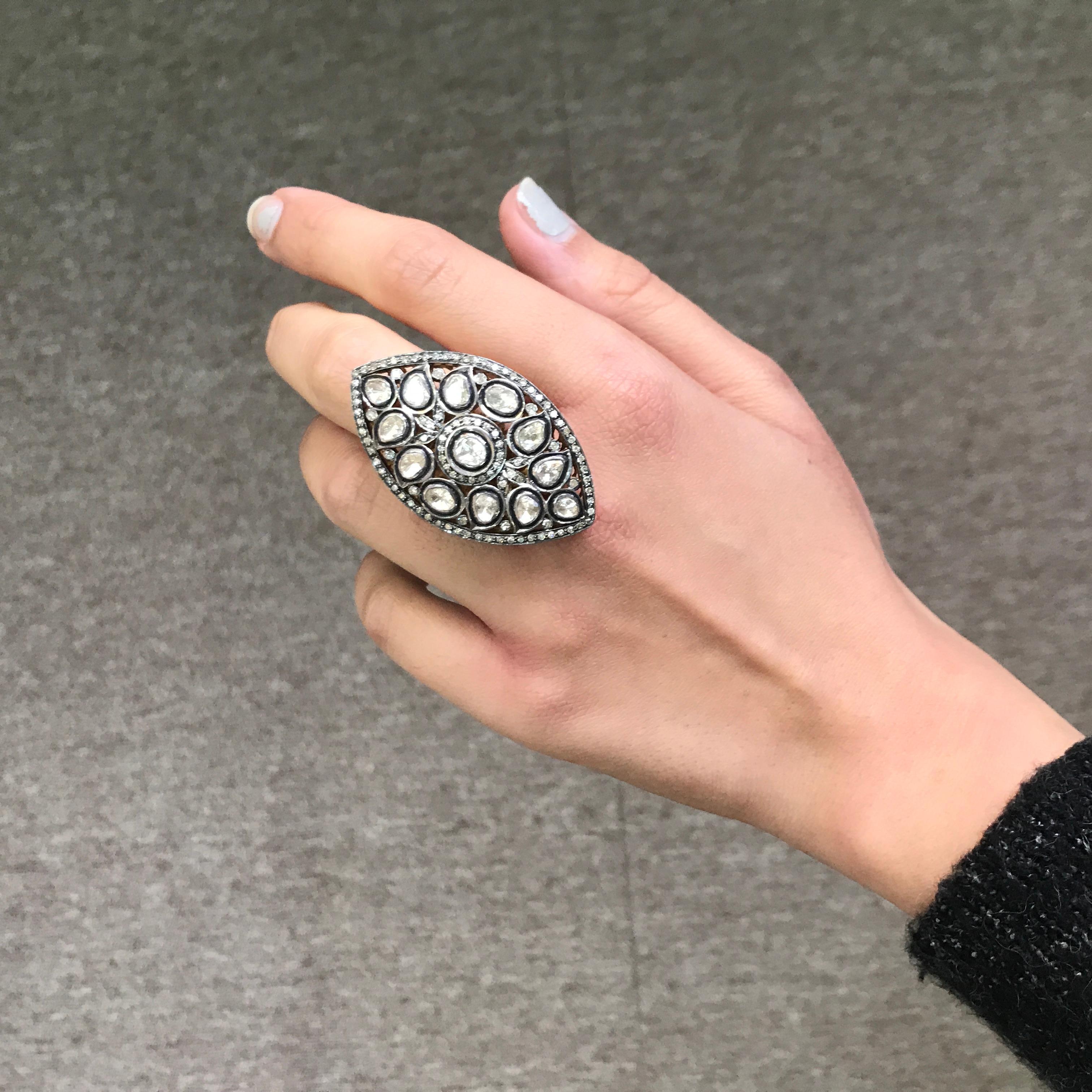 A stunning, statement ring with around 3 carat rose cut white diamonds set in silver. The black rhodium polish gives the ring a beautiful, antique look. Currently a size 6.5, can be resized. 
