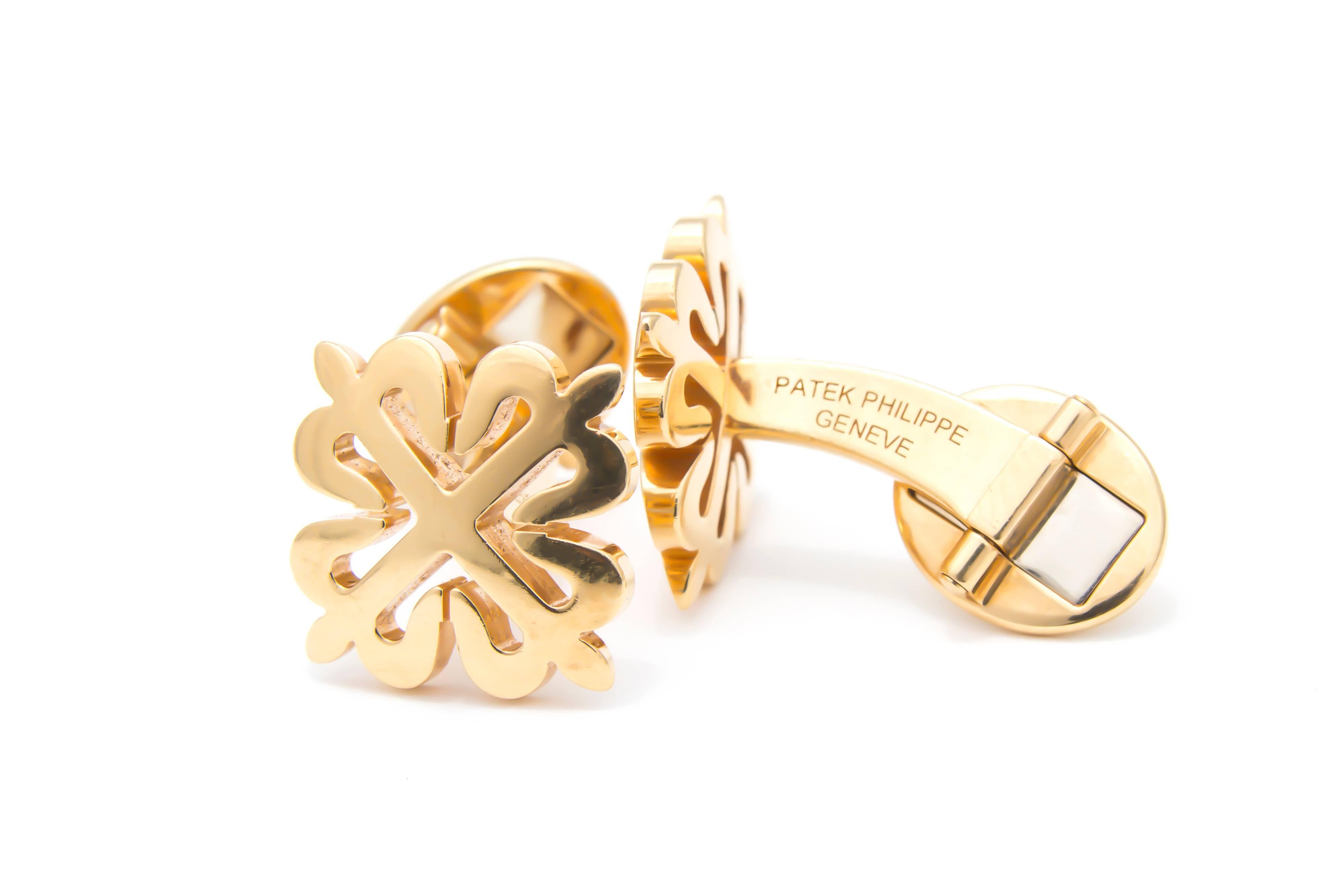 A pair of Patek Philippe 18 carat gold Calatrava Cross cufflinks. Each is designed as a cross motif, with hinged reverse. Maker's marks for Patek Philippe. Swiss convention marks. Length of cufflink face is 1.9 cms. Weight 18.6 grams. 
These classic
