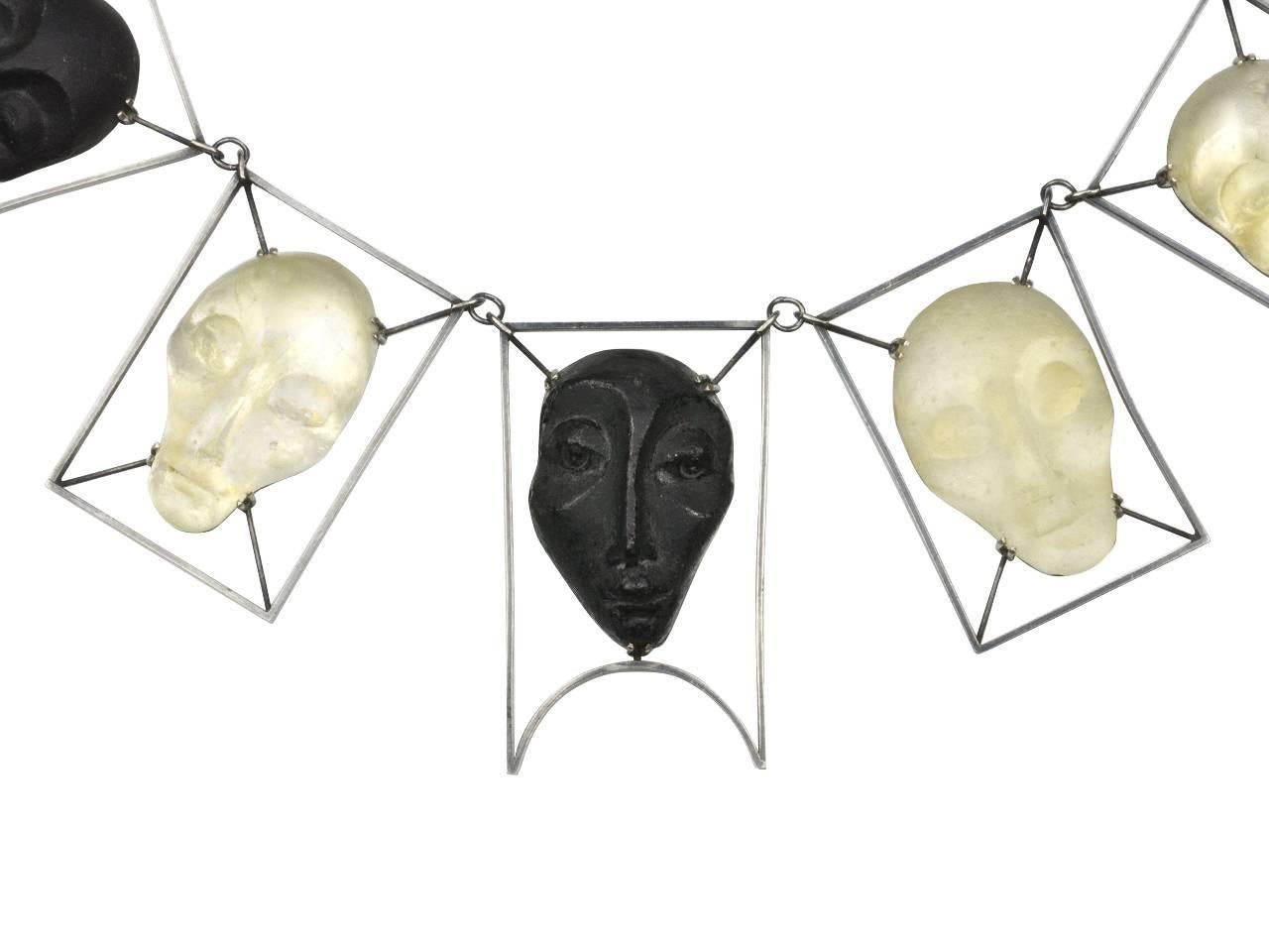 BLackened silver necklace featuring frosted and black glas masks. Signed IMRE '96.