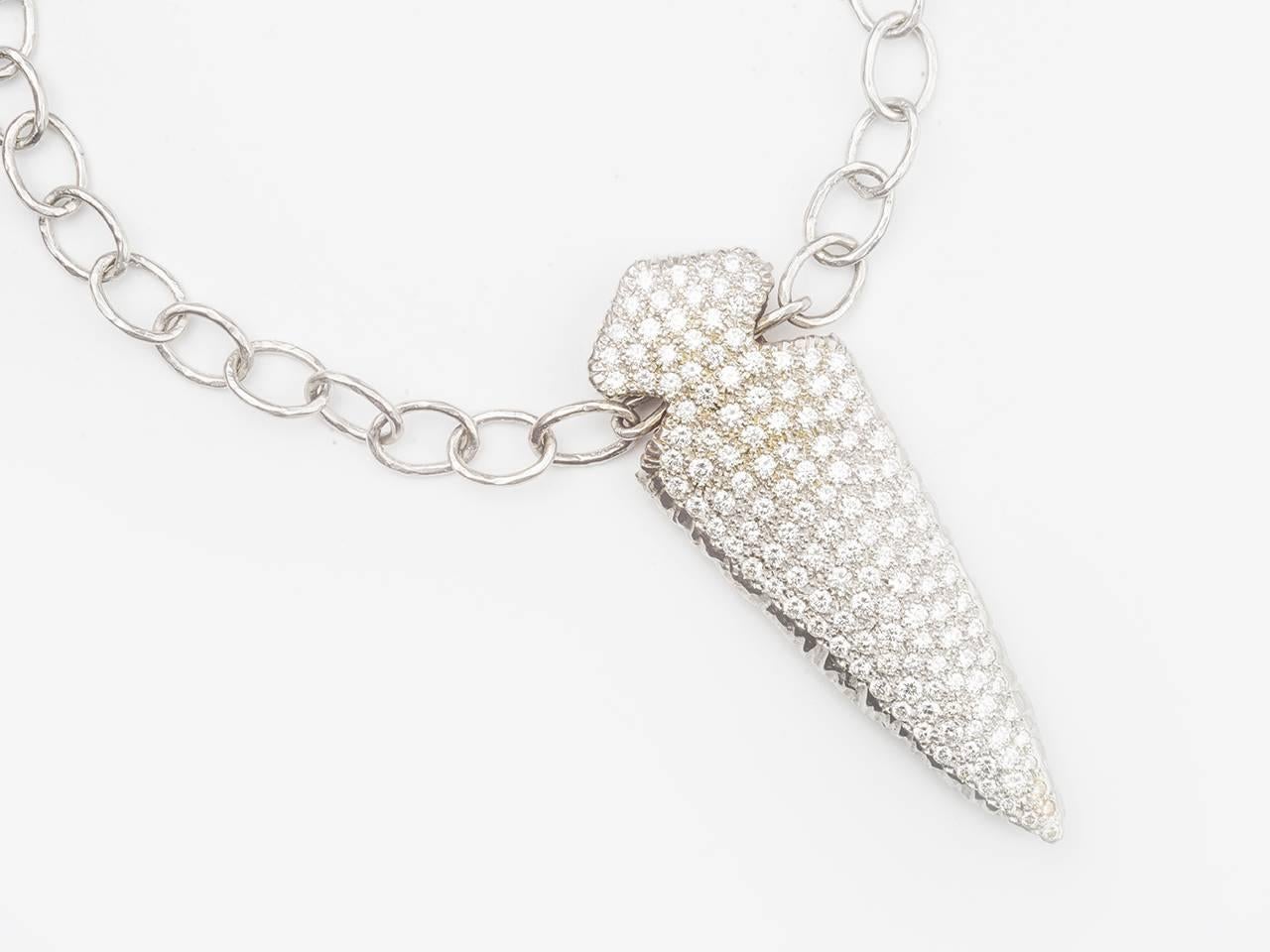 18k gold Flintstone Chain, suspending a paveset Arrowhead pendant by Loree Rodkin. Approximately 6.50 carats , makers mark. Estate of Jackie Collins.