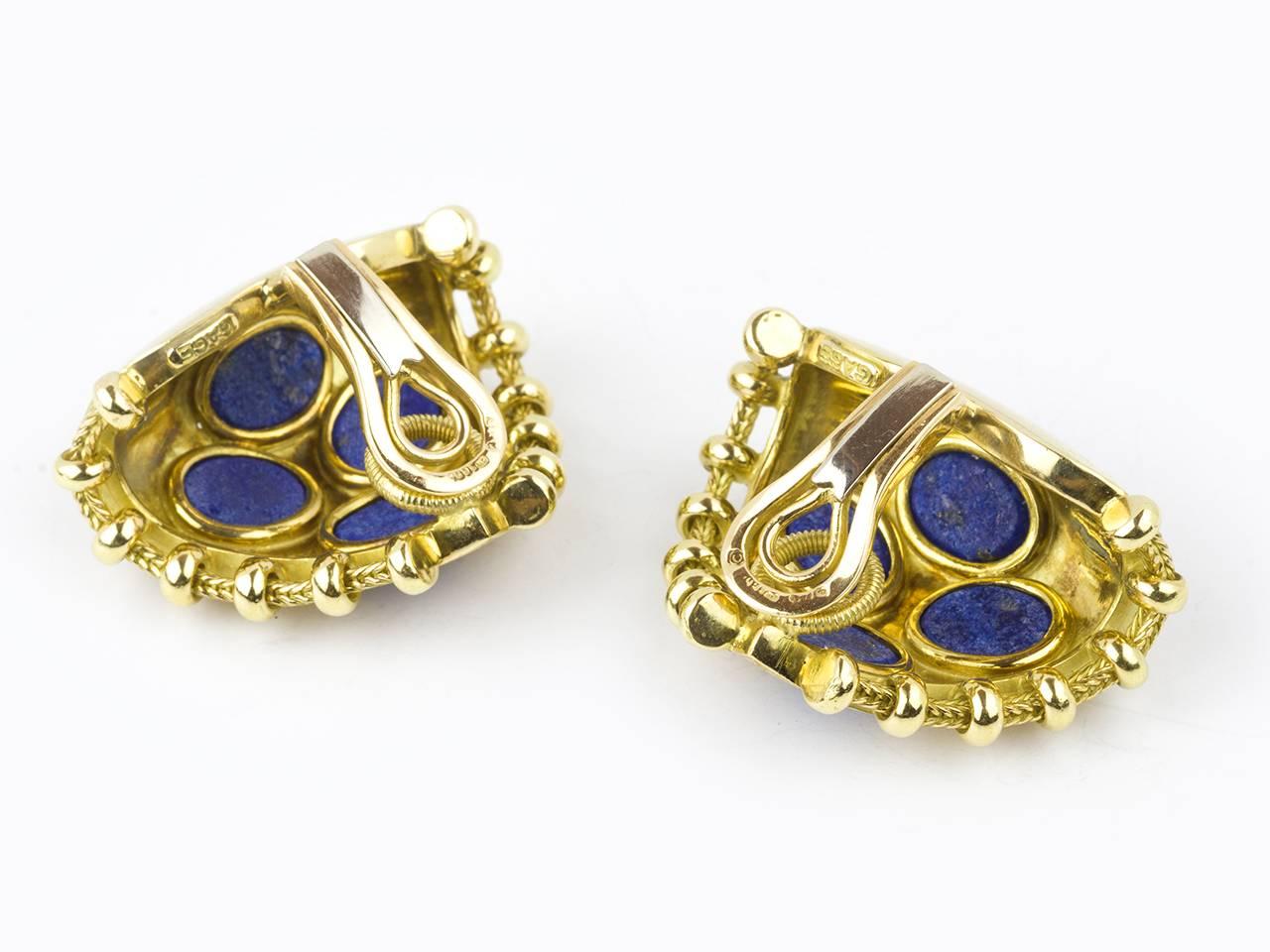 18k gold Trefoil earclips set with 3 lapis cabochons. Signed GAGE, English marks.