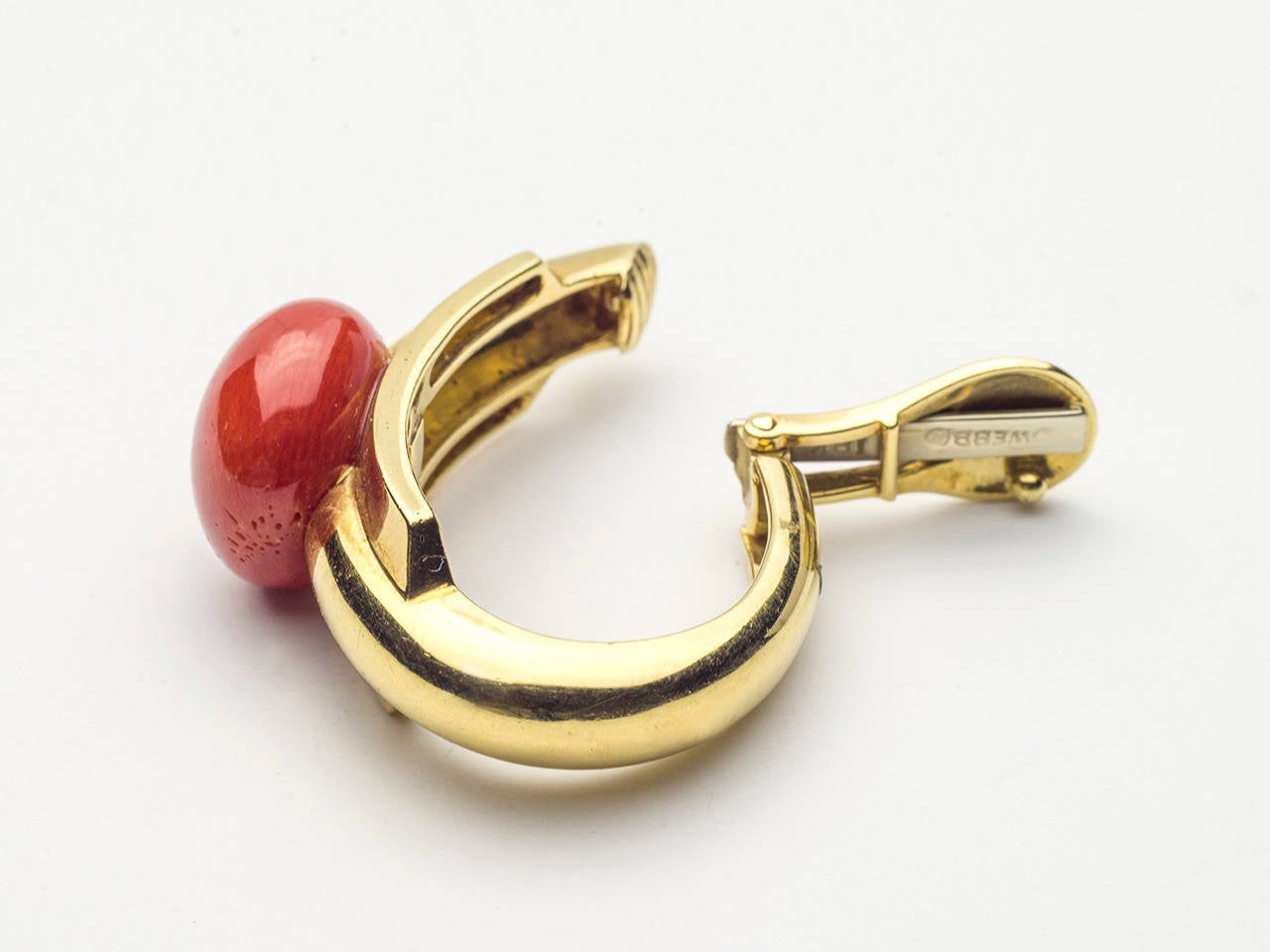 18 K ear hoops set with coral in a beautiful deep red. Signed WEBB 18 K.