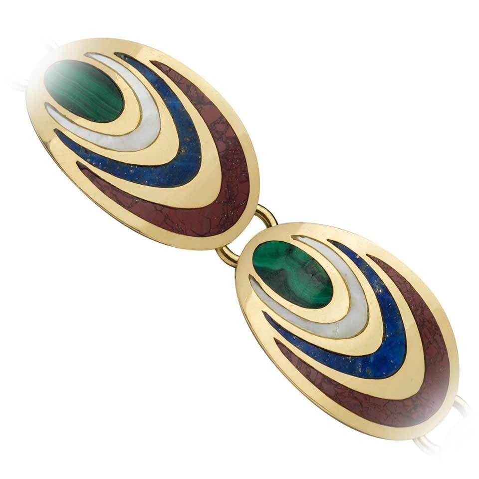 18 kt. gold plaque link bracelet inlaid with malachite, mother-of-pearl, lapis and jasper. French import marks.