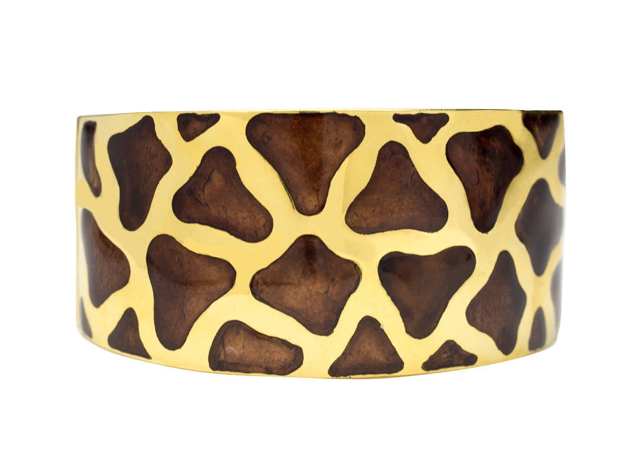 A  hinged cuff bracelet and earclips of Giraffe design, mounted in 18 k gold and rich brown enamel. Inner circumference - 6-1/2
