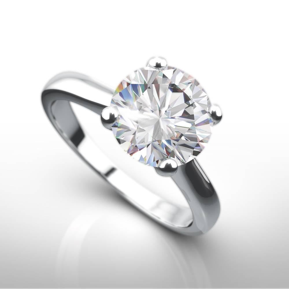 Stunning 2.05ct E/Si1  brilliant cut round natural diamond engagement ring crafted in lustrous platinum in the style of the Cartier 4 claw ring. All ring sizes available as made to order and hand finished to perfection by our skilled craftsmen in