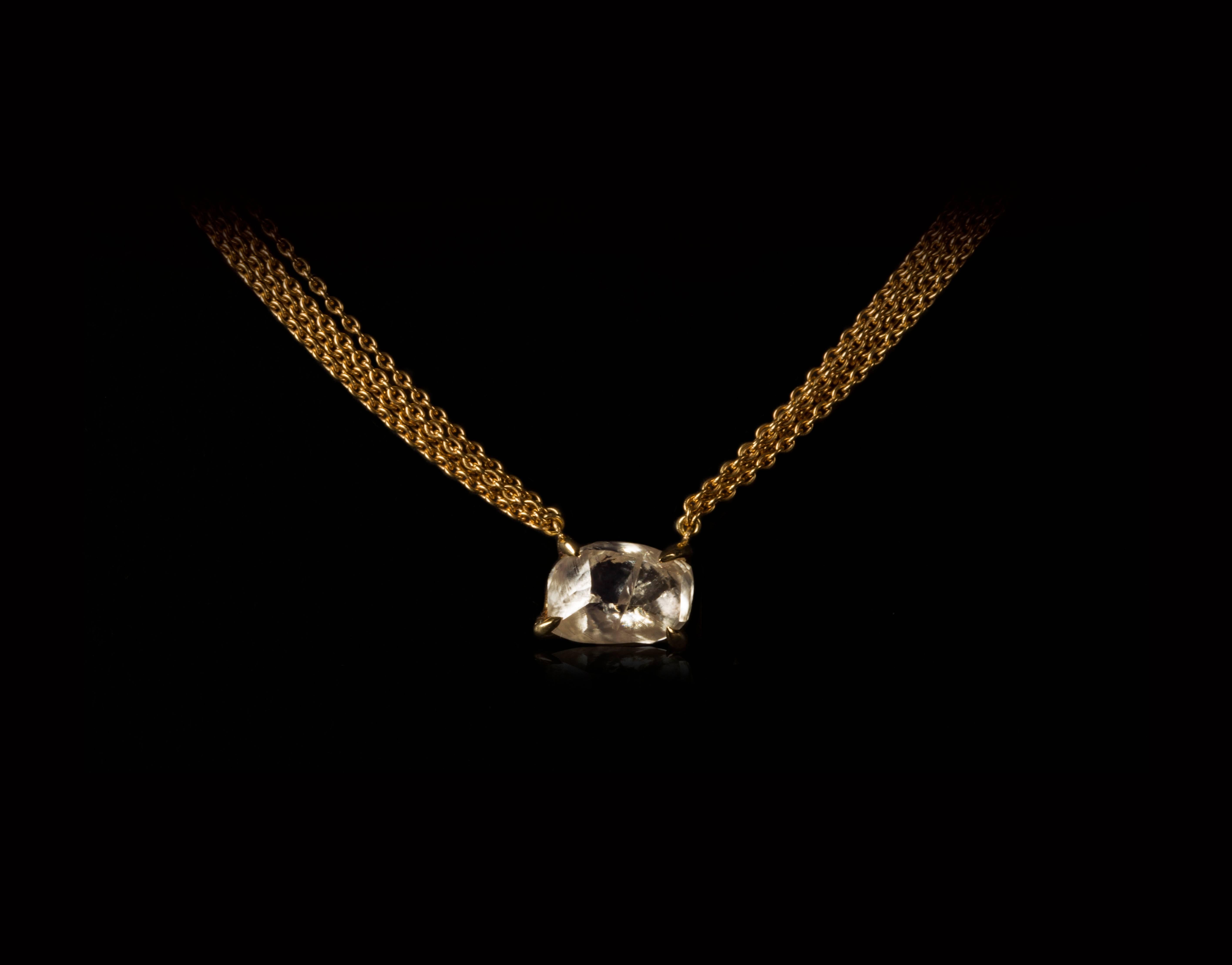 4.19 natural carat rough, uncut diamond in a 14K gold setting suspended from multiple 18 karat gold chains and set in a unique one-of-a-kind necklace.

Every rough diamond from Roughdiamonds dk has been personally handpicked by Maya Bjørnsten right