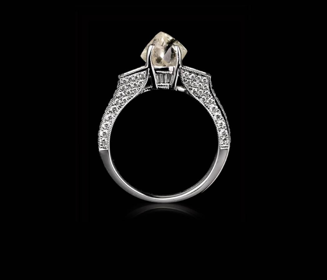 One-of-a-kind 1.87 carat natural whitish rough diamond surrounded by 0.61 carat TW/VS Brilliants, 0.36 carat TW/SI Princess Cut and 0.07 carat Trapez cut diamonds in an 18 karat white gold engagement ring. 

Every rough diamond from Roughdiamonds dk