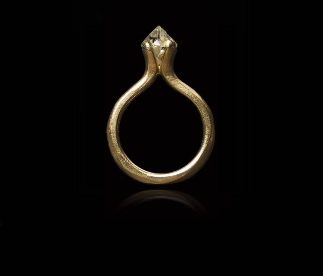 This 2.08 carat uncut and unpolished natural whitish octahedron rough diamond has been set in a handcrafted princess-style 14 karat gold ring with a brushed surface.

Every rough diamond from Roughdiamonds dk has been personally handpicked by Maya