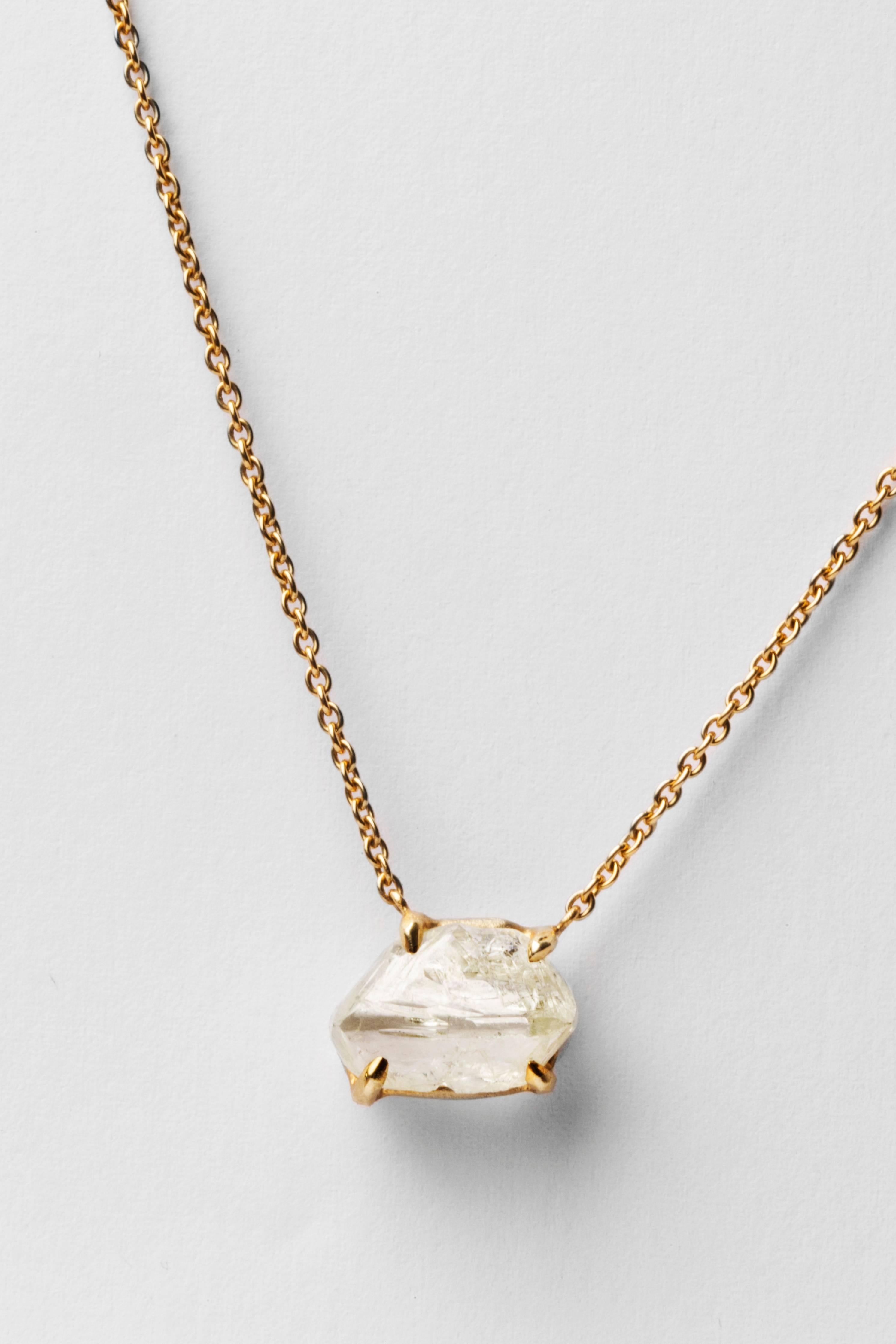 A Natural 5.62 ct. rough, uncut diamond from South Africa set in a handcrafted 14 karat setting and 18 karat gold chain necklace. If cut, the diamond would most likely become a Top Crystal (equivalent to I-colour).

Every rough diamond from