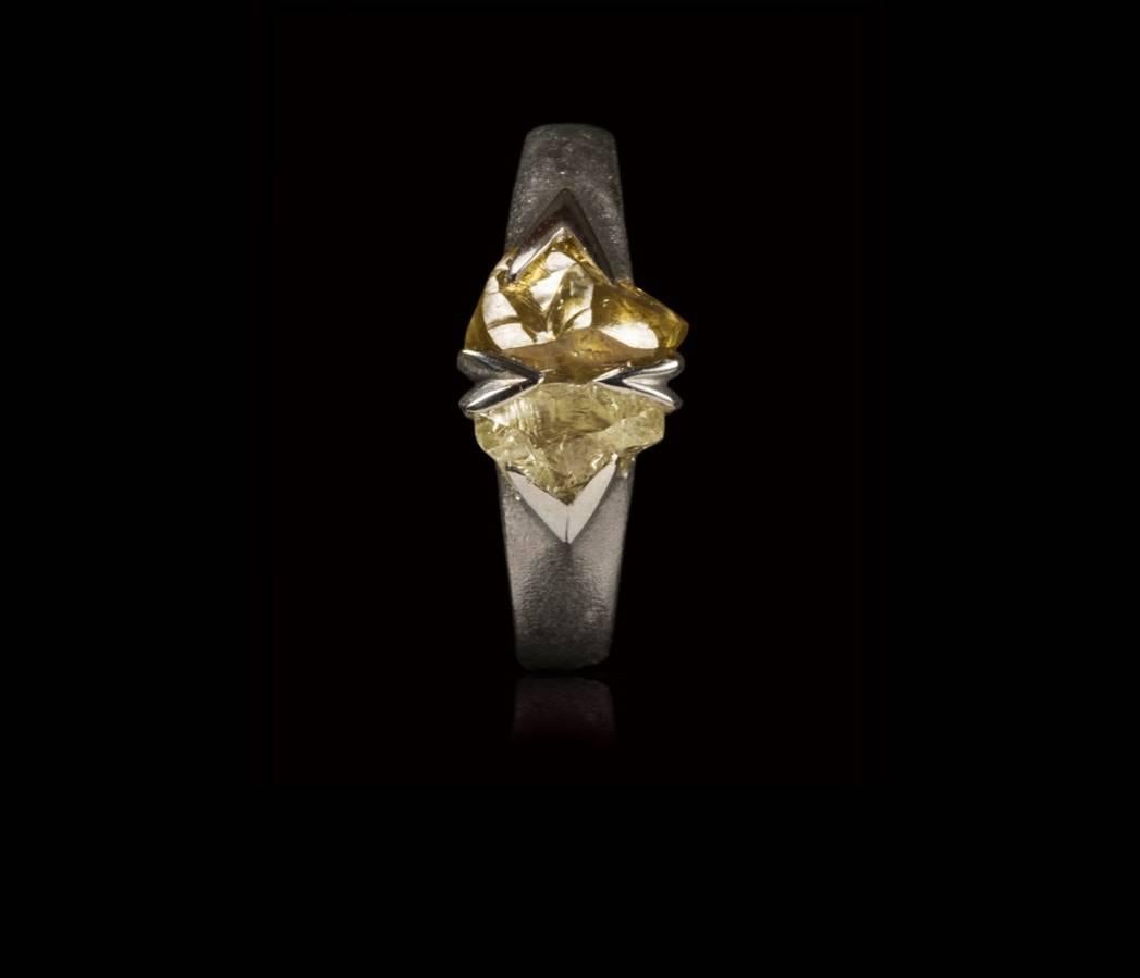 Two natural triangle uncut rough diamonds from Mother Nature set in a 14 karat handmade white gold ring with specially handcrafted prongs to accentuate the unique shape of the stones.

Every rough diamond from Roughdiamonds dk has been personally