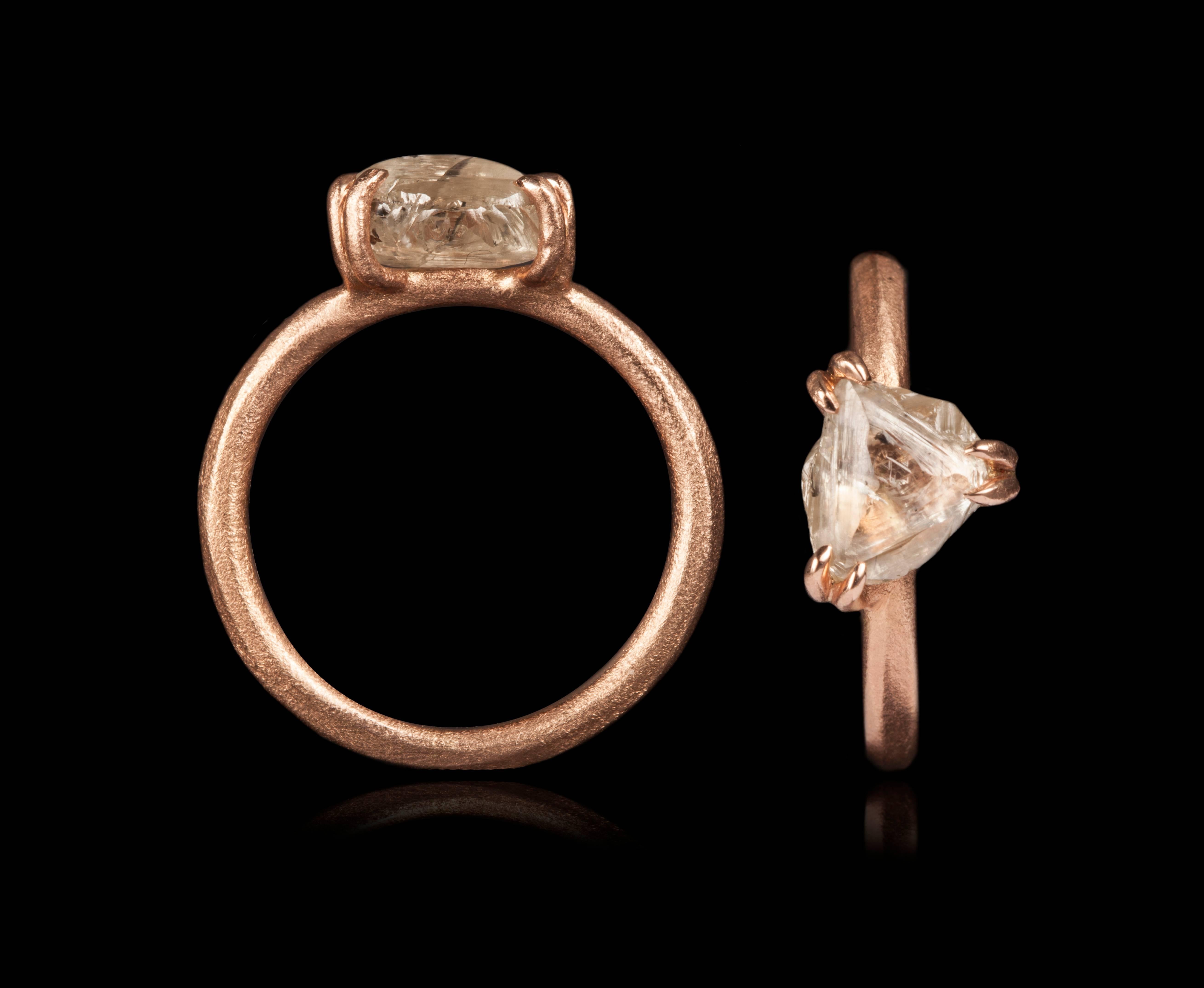 2.67 ct. Natural White Greyish Triangle Rough diamond in 14K handcrafted rose gold ring.

Every rough diamond from Roughdiamonds dk has been personally handpicked by Maya Bjørnsten. The diamonds we reject are sent back to be cut into regular
