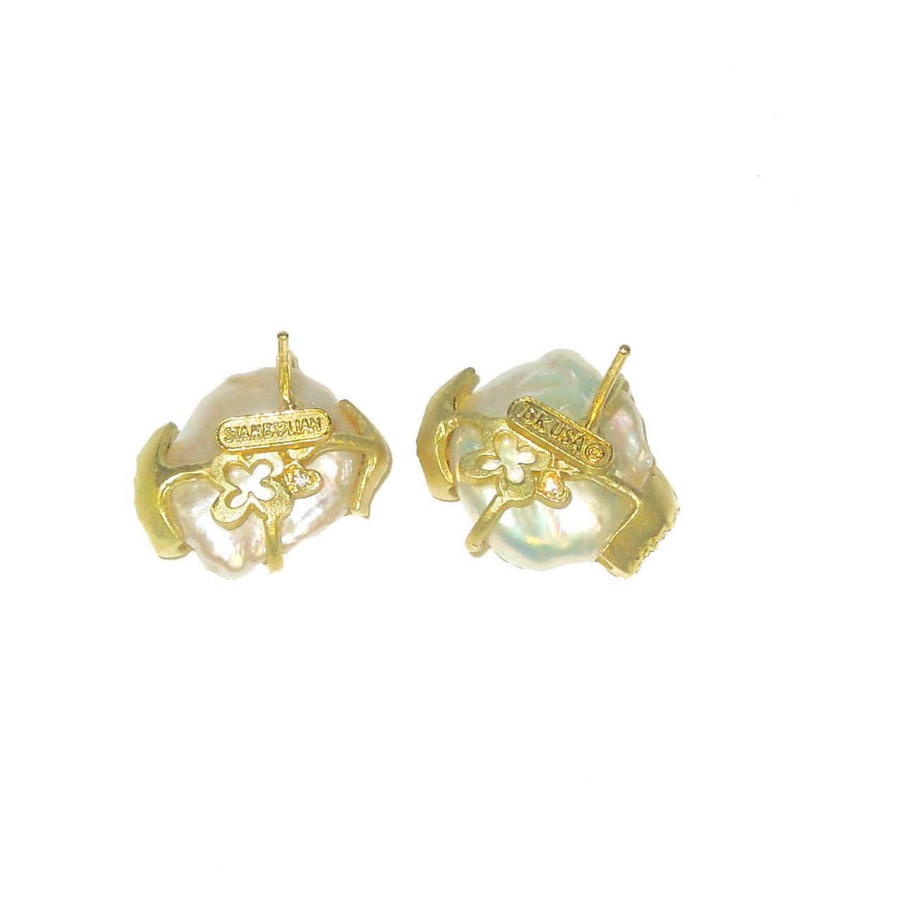 18K Gold Earrings with Kashi Pearl Centers w/ Gold & White Diamonds surrounding the pearls

Post back makes this a comfortable fit on your ear.

0.50 ct.'s of G Color, VS Quality Diamonds

Earrings are signed STAMBOLIAN with our Trademark