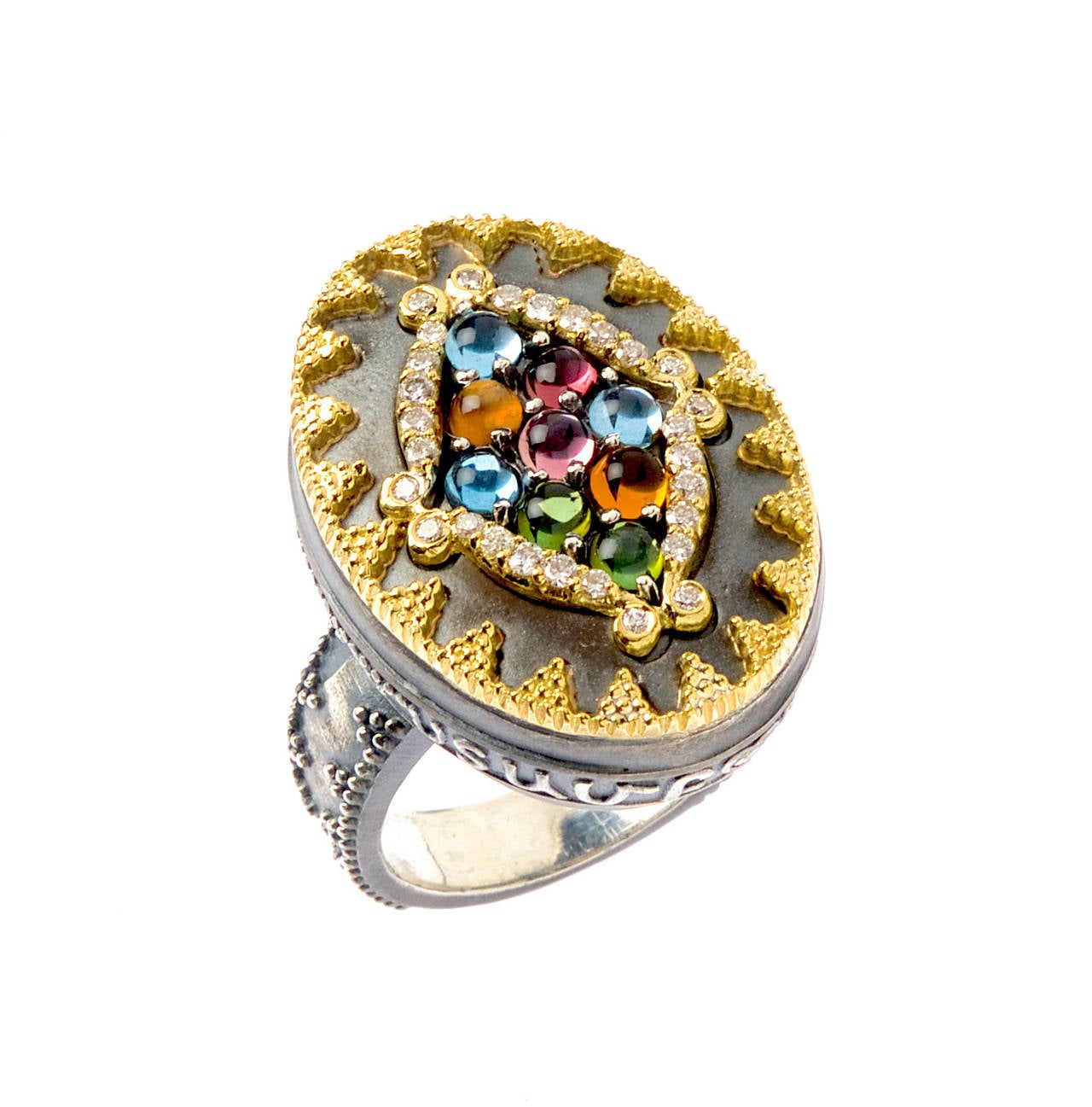 Aged Silver & 18K Gold Ring with Tourmaline Cluster surrounded by diamonds

1.42 ct. apprx. Tourmalines

0.32 ct. apprx. Diamonds

On the edge of the ring reads STAMBOLIAN in Armenian letters. 

Available in sizes: 5-12

Signed STAMBOLIAN with our