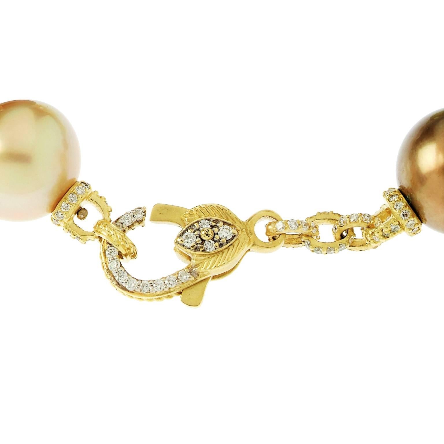 18K Gold Bracelet with South Sea Pearls 

Diamond links in between each pearl

3.40ct. G Color VS Quality Diamonds

6, 14mm, South Sea Pearls AAA Quality

Entire piece is covered in diamonds, including clasp.

8 Inches in length.

Signed