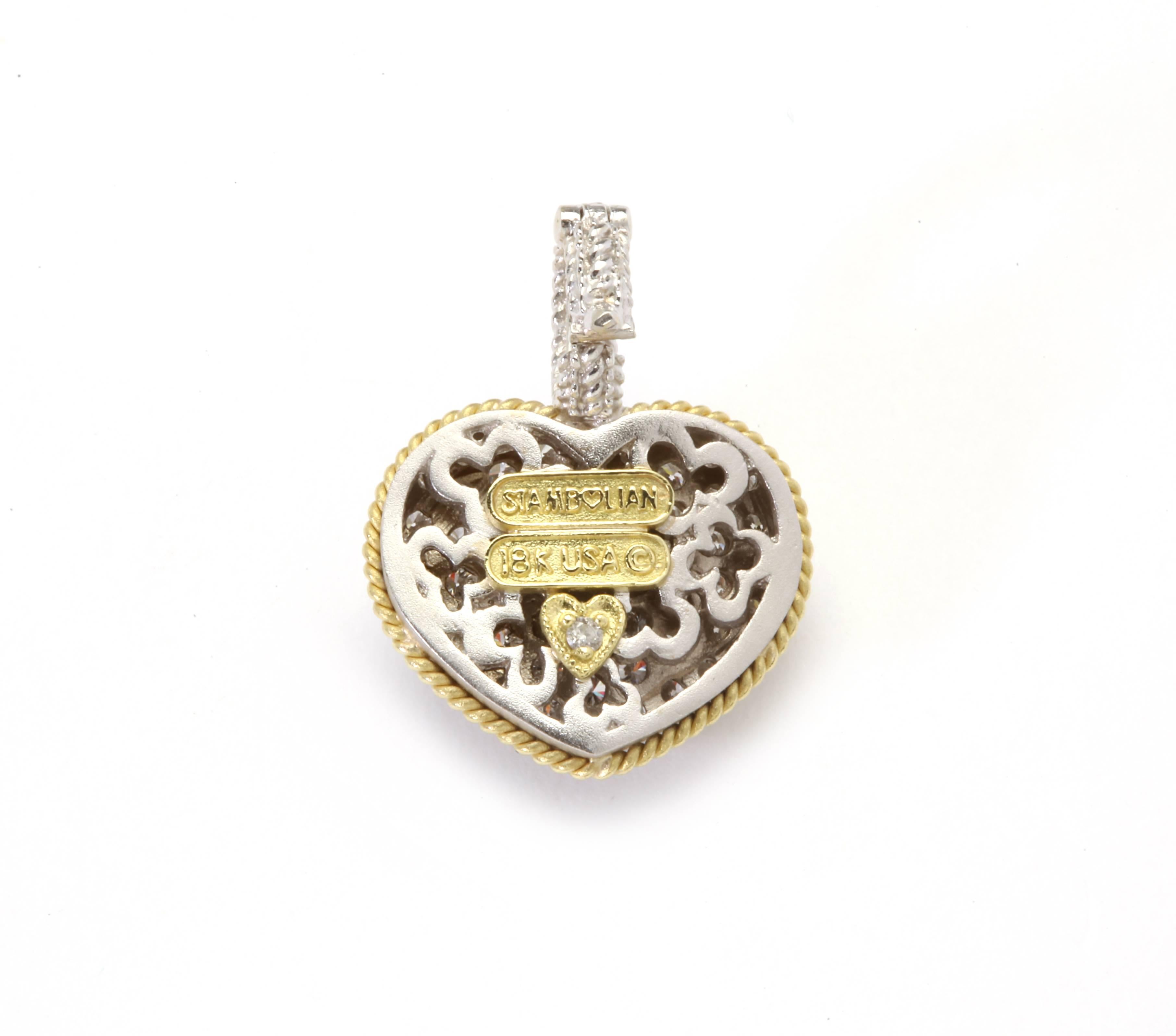 18K Gold Heart Enhancer Pendant with diamonds

Heart has a concave effect to it. 

Diamonds cover from the top of bell to being pavé set throughout the piece

1.50ct. G Color, VS Clarity Diamonds

1 inch length

Signed STAMBOLIAN with our Trademark