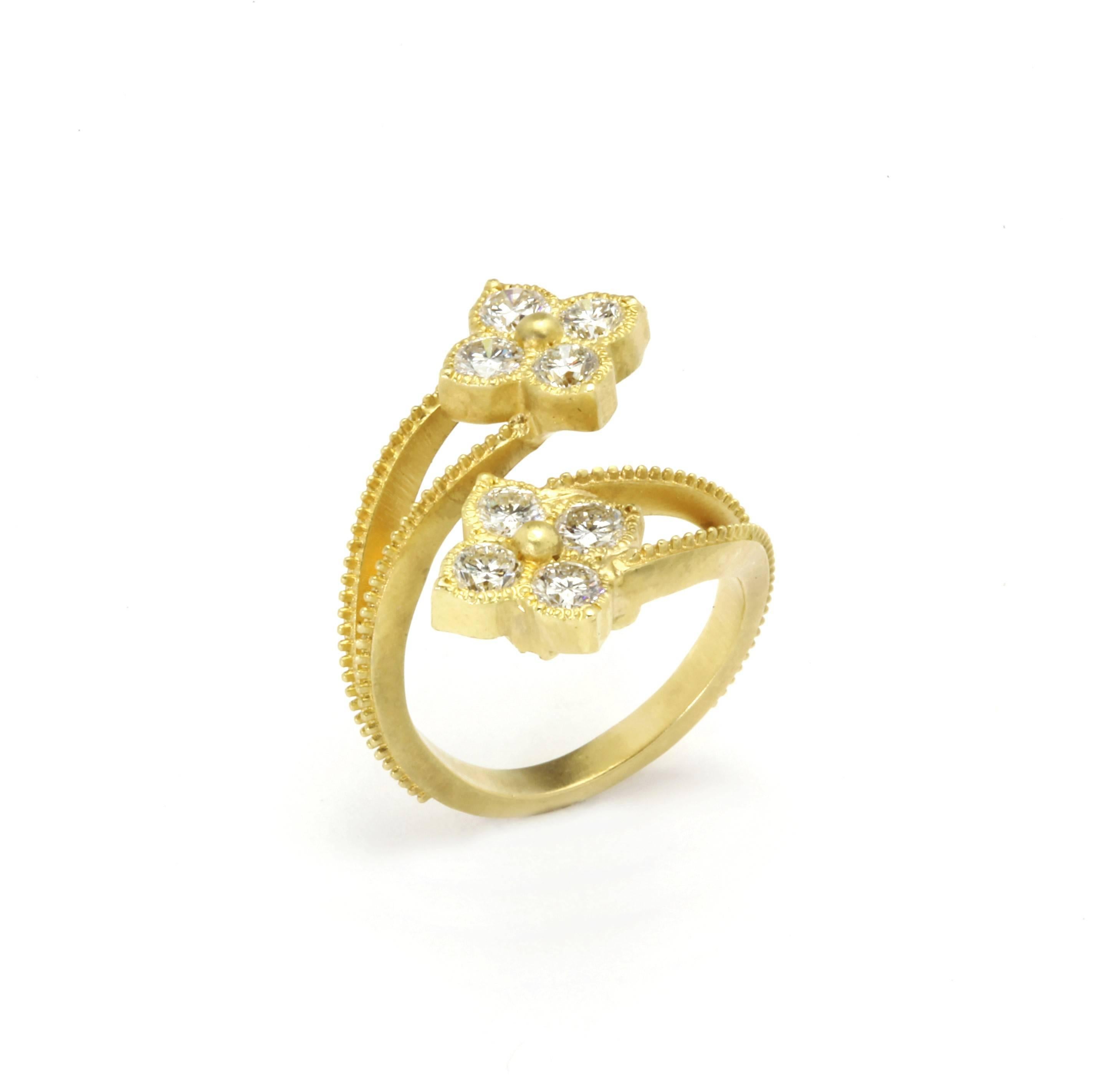 18K Yellow Gold and Diamond Double Cluster Bypass Ring by  Stambolian

Ring features two clusters, each with four diamonds. This bypass ring crosses over one another to bring the true and original beauty of simplicity.

1.77 carat G color, VS