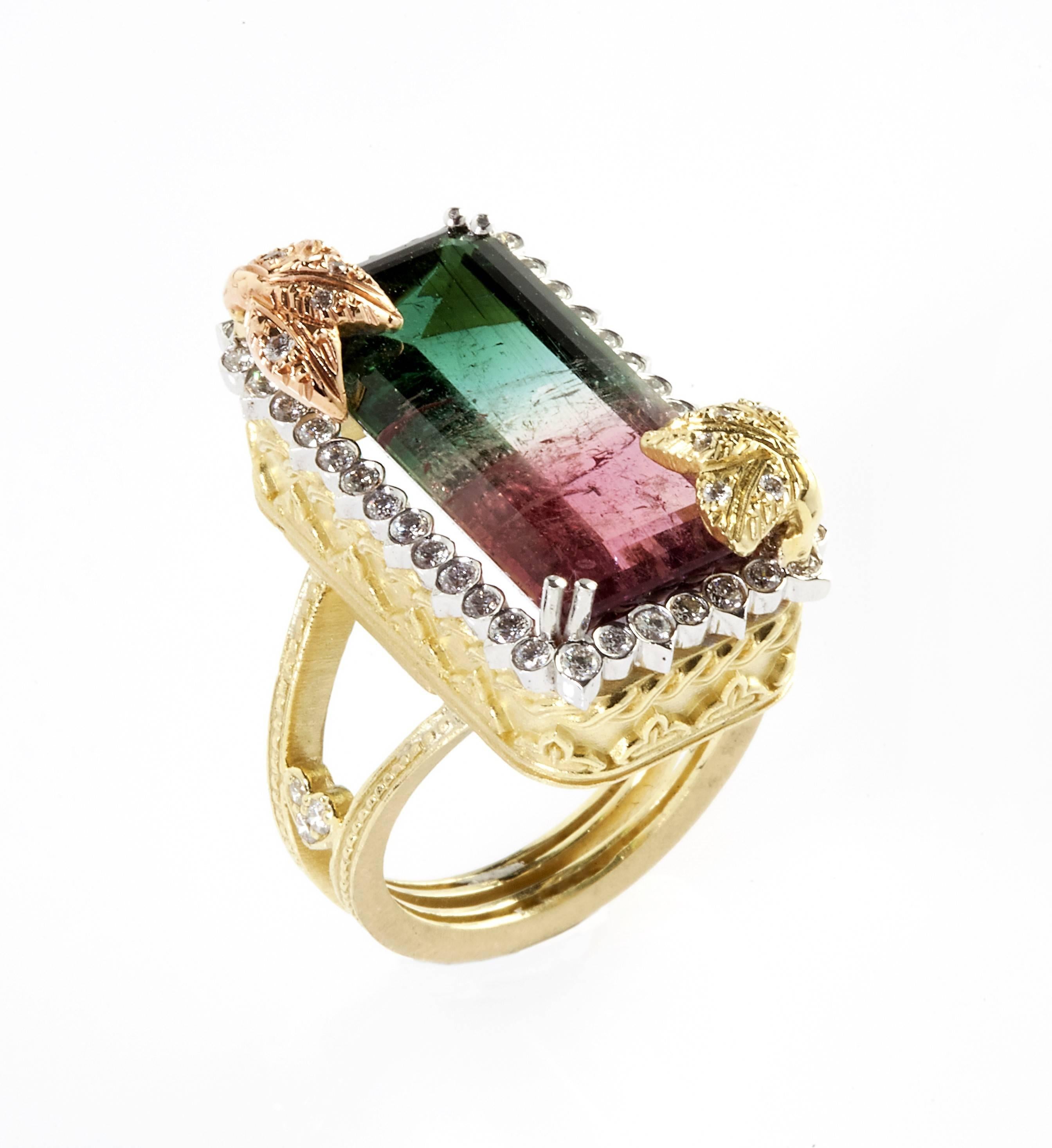 18K Tri-Color Gold Ring with Watermelon Tourmaline Center surrounded by diamonds

16.52ct. Watermelon Tourmaline Center, above two corners are pink and yellow  gold with diamonds, floral design work.

Watermelon Tourmaline 23mm x