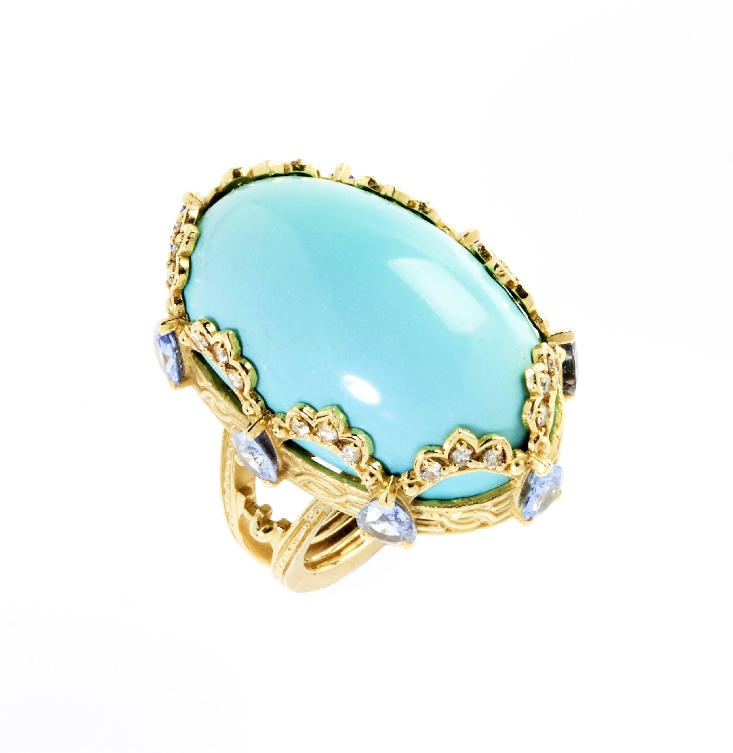 18K Gold Ring with Persian Turquoise Center surrounded by blue sapphires and diamonds

Center Persian Turquoise 29.42ct., 28mm x 18mm.

Beautiful accents are given by pearshape Blue sapphires all around the ring, weighing 2.65ct. They offer a