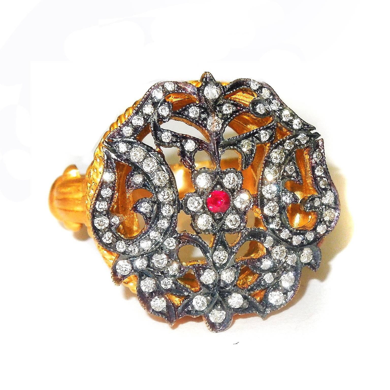 14K Yellow Gold Ring with Diamonds

0.43ct. H Color, VS Clarity Diamonds 
Center has one Ruby

Stones are set on blackened silver. Rest of ring is done in 14k gold

Face dimensions: 0.80 inch W x 0.80 inch L

11.1 grams 14k gold

Currently size 7.5.