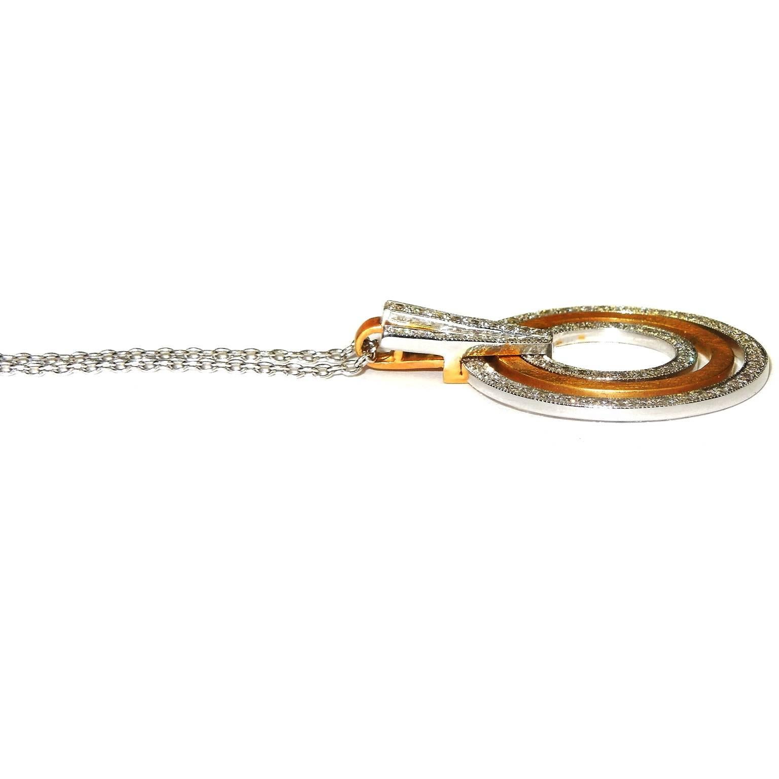 18K Yellow and White Gold Pendant with 14K White Gold chain

1.25ct. G Color, VS Clarity Diamonds

Pendant: 1.4 inches L x 1.1 inch W

Chain is done in 14K white gold, 20 inches

13.68 grams total gold

Made in Turkey

Estate