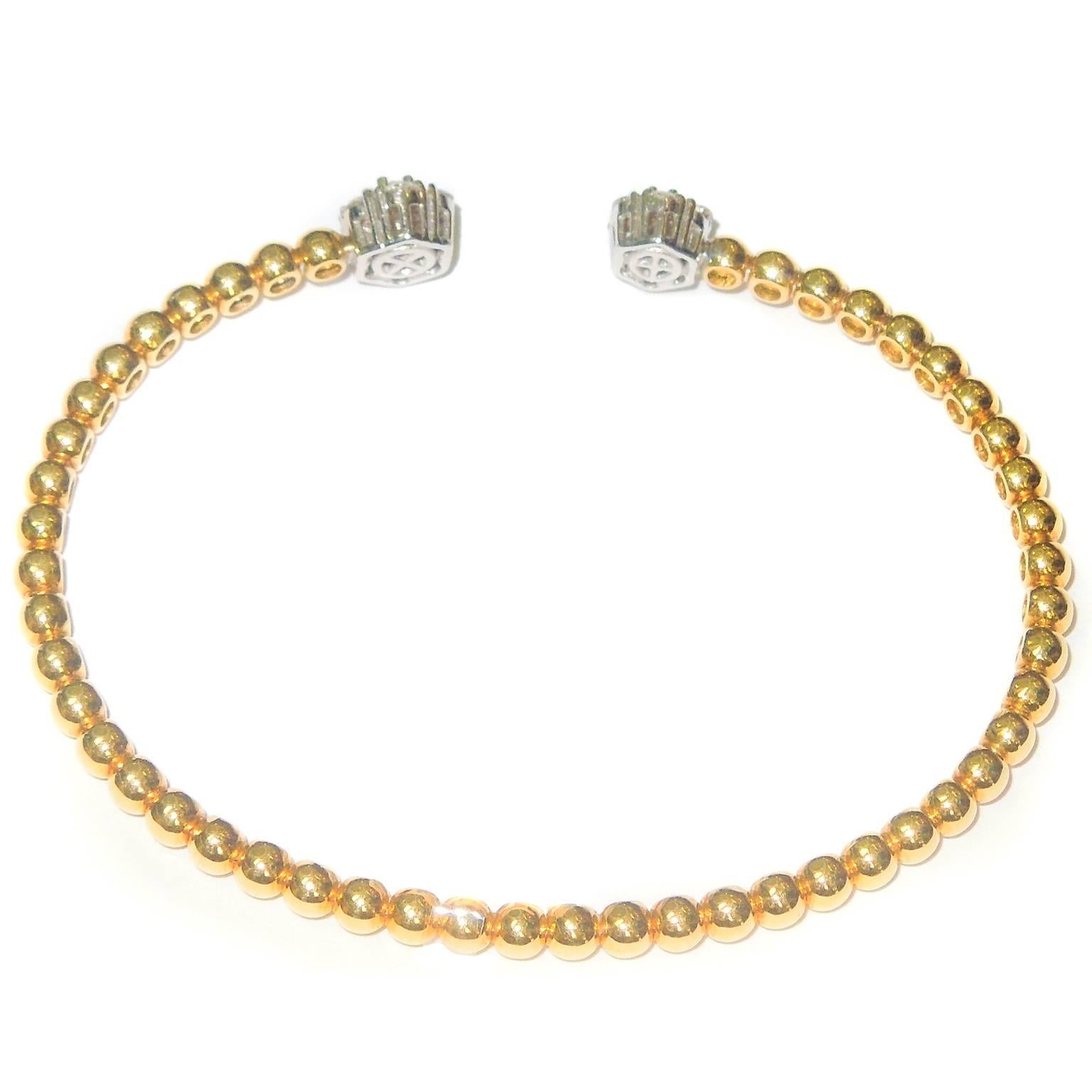 18K Yellow Gold Flexible Bracelet with Two Diamond Clusters

0.70ct. G Color VS Clarity Diamonds

Diamond clusters are both different sizes with different size diamonds

Larger cluster: 0.3 inch width
Small cluster: 0.2 inch width

Bracelet width