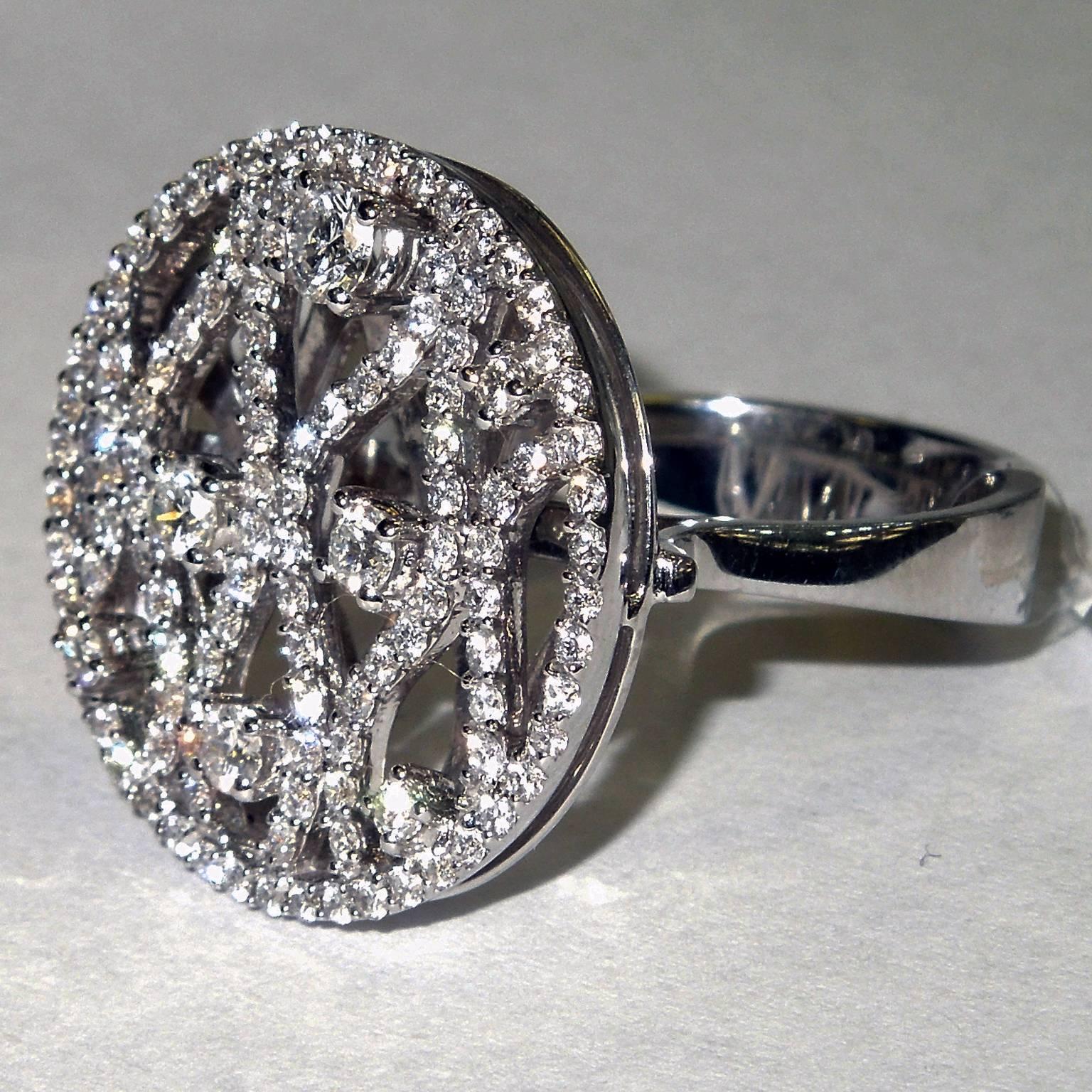 18K White Gold Ring with Diamonds

1.32ct. G Color, VS Clarity Diamonds

Face of ring is 0.85 inch round

Ring is size 7. Can be sized.

