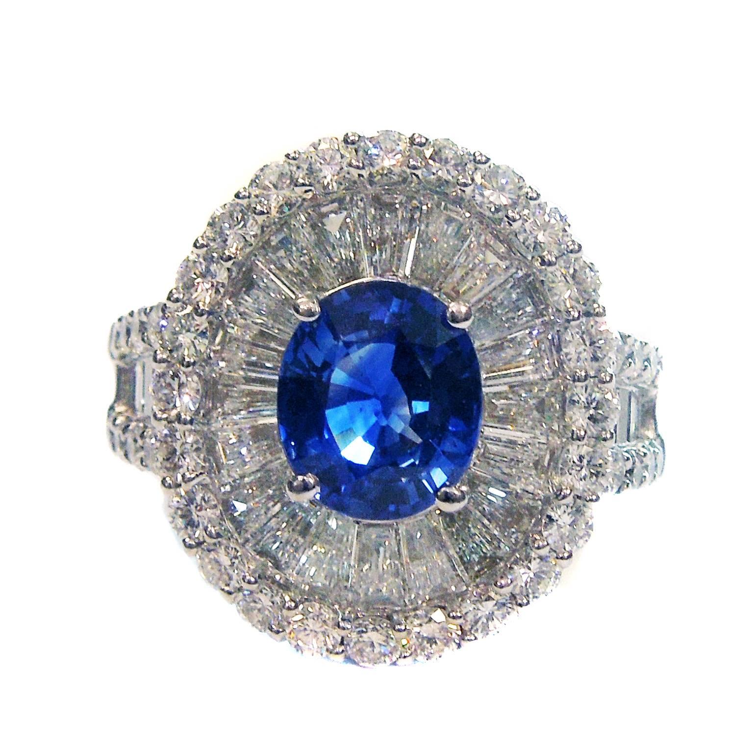 18K White Gold Ring with Blue Sapphire Center and Diamonds

Apprx. 2.00ct. Blue Sapphire Center

Emerald and Round cut diamonds all throughout. 3.00ct. apprx. total weight.

0.7 inch Face Length. 0.6 Face Width. 0.3 band width

Currently size 6.5.