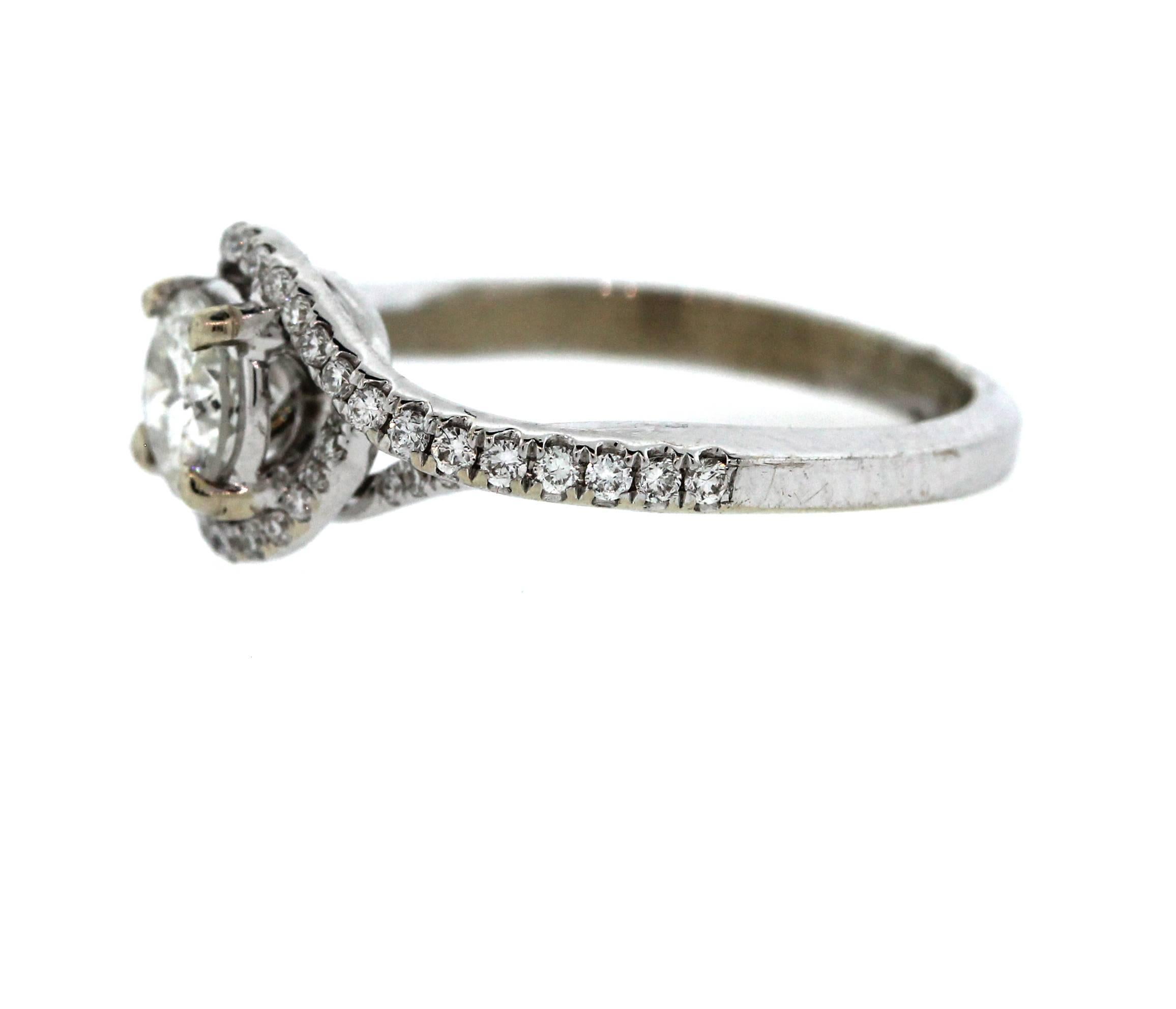 Beautiful 14K White Gold Engagement Ring with 0.65 carat Diamond Center

The center stone is 0.65 Carat K Color, I3 Clarity

0.45 ct. Diamonds make up the sides of ring and around center

Ring is currently size 6, sizable. 

Weights 4 grams