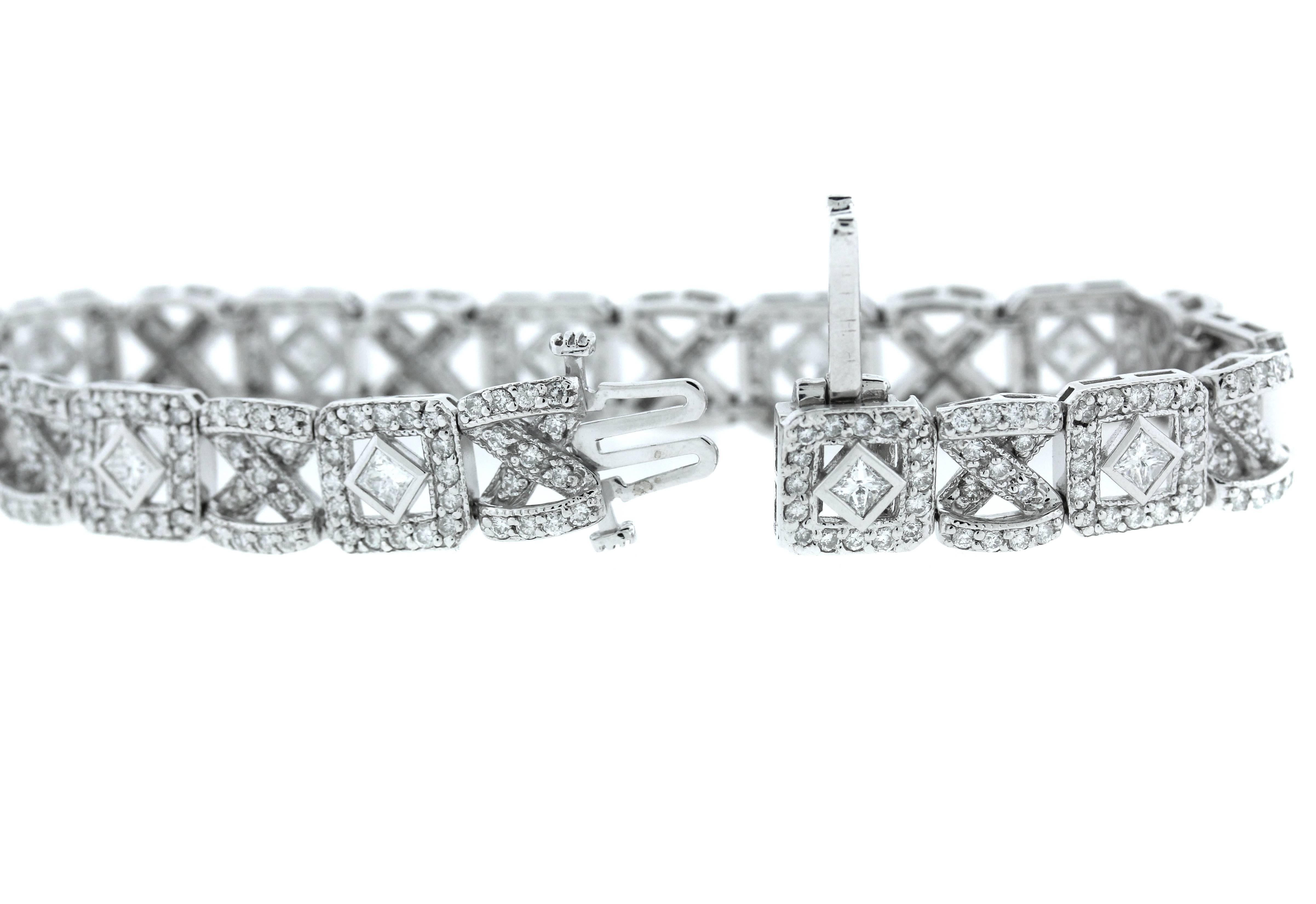 14K White Gold Bracelet with Round and Princess Cut Diamonds

5.66ct. Diamonds total weight

Bracelet is 7 inches in length and 0.4 inch wide

Push button clasp with safety used to open and close.

21.7 grams

Estate