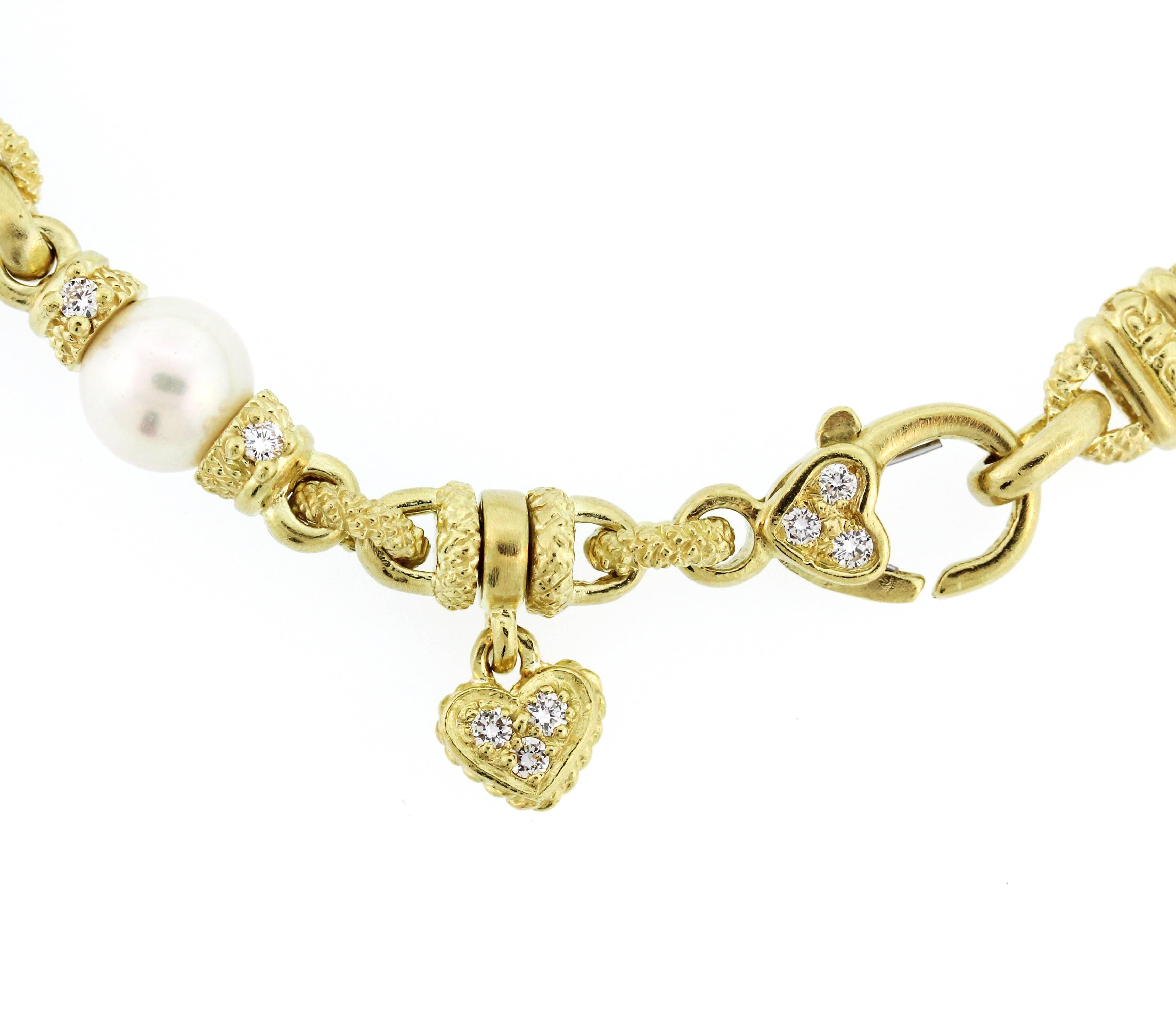 Judith Ripka

18K Gold Chain Necklace with Diamonds and Pearl and Heart Pendant

Gorgeous chain has diamonds on the lobster clasp in the center with dangling tiny diamond heart as well as a 5mm pearl.

Heart enhancer pendant has diamonds throughout.