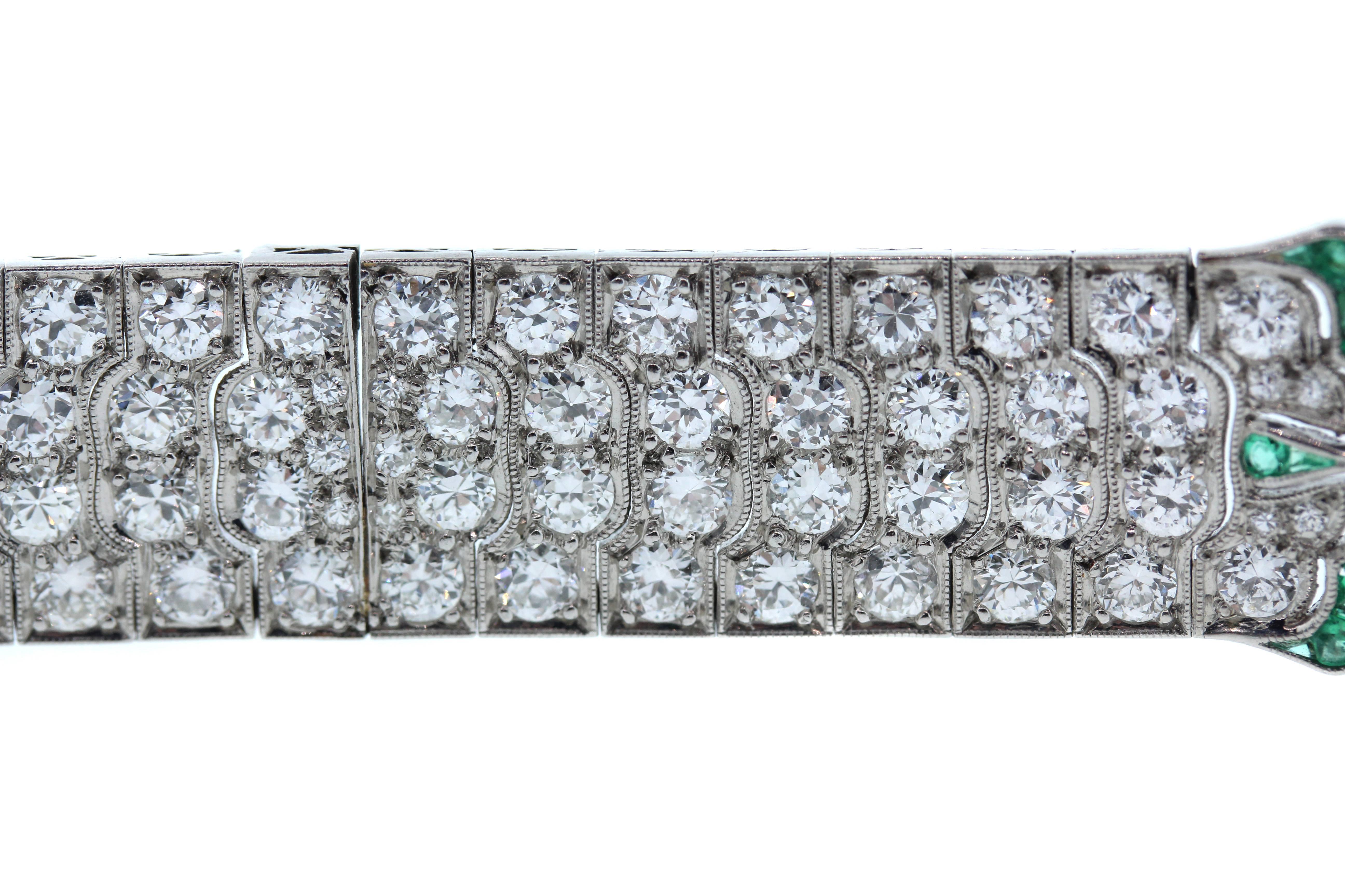 Art Deco Platinum Bracelet with Diamonds and touch of Emeralds

Apprx. 19.00ct. Diamonds cover entire bracelet

Tiny touch of emeralds on both sides of bracelet. 

6.5 inches length x 0.5 inch wide

Estate
