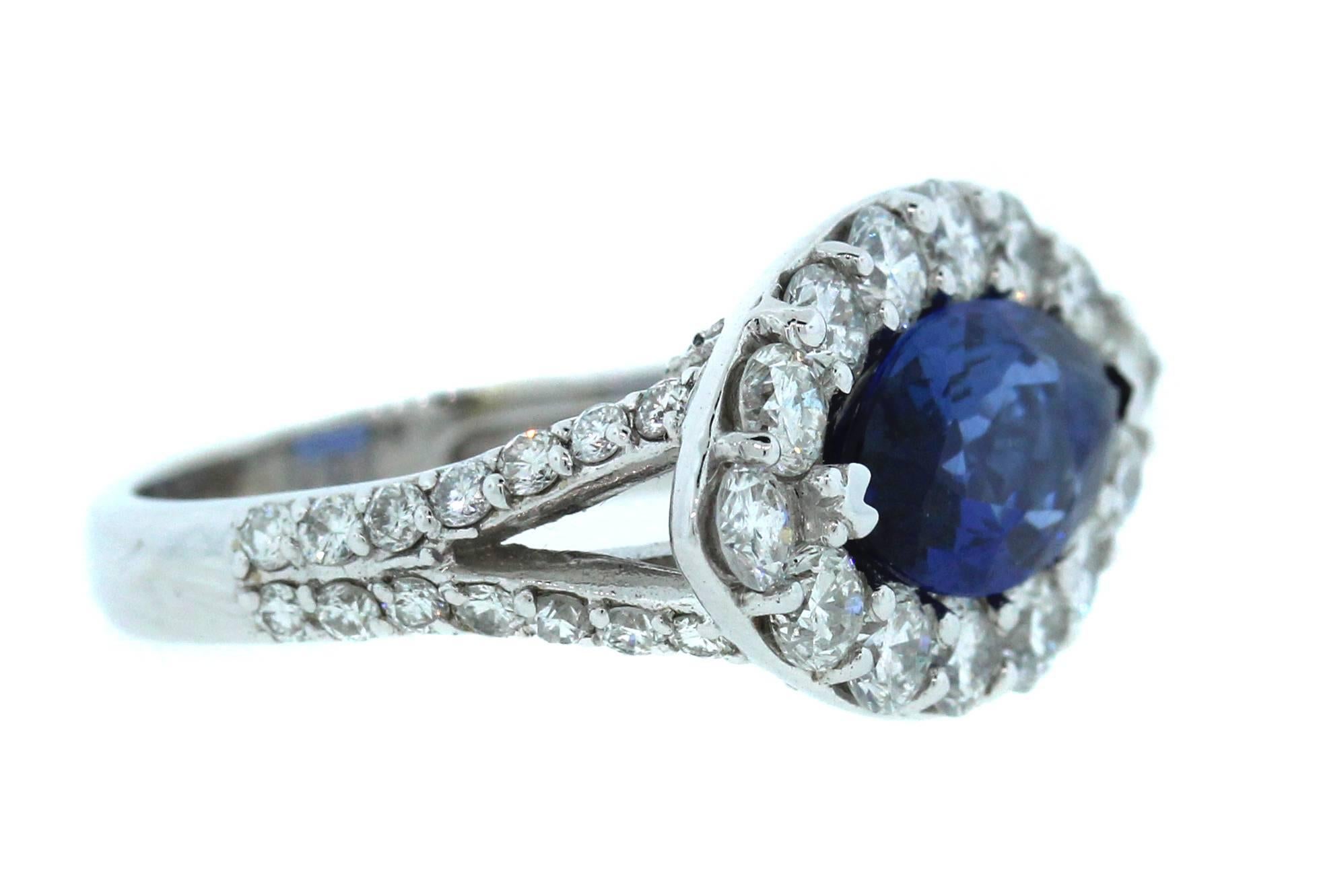 18k White Gold Ring with Blue Sapphire Center Surrounded by Diamonds

2.55ct. Blue Sapphire. Marquis cut

2ct. apprx diamonds throughout face of ring and half of shank

Sapphire is gorgeous blue!

Face of ring is 0.8 inch length x 0.45 inch