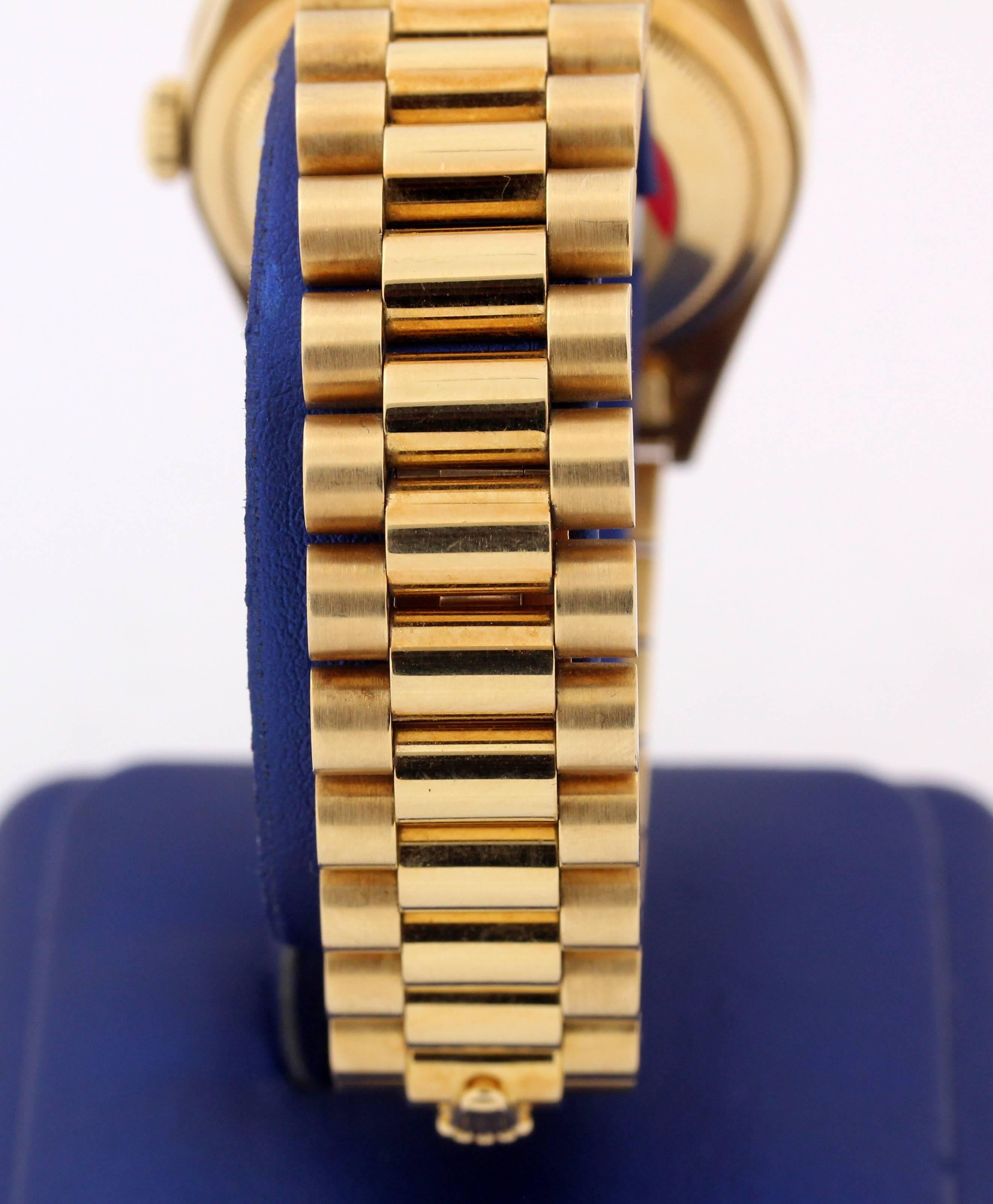 Yellow Gold Double Quick Rolex Day Date with Custom Bezel Features:

Very Good Condition

Model Name: Day Date President 36mm

Aftermarket Customer Diamond bezel with 40 diamonds

No box or papers

Entirely done in 18K Yellow Gold 

Retail:
