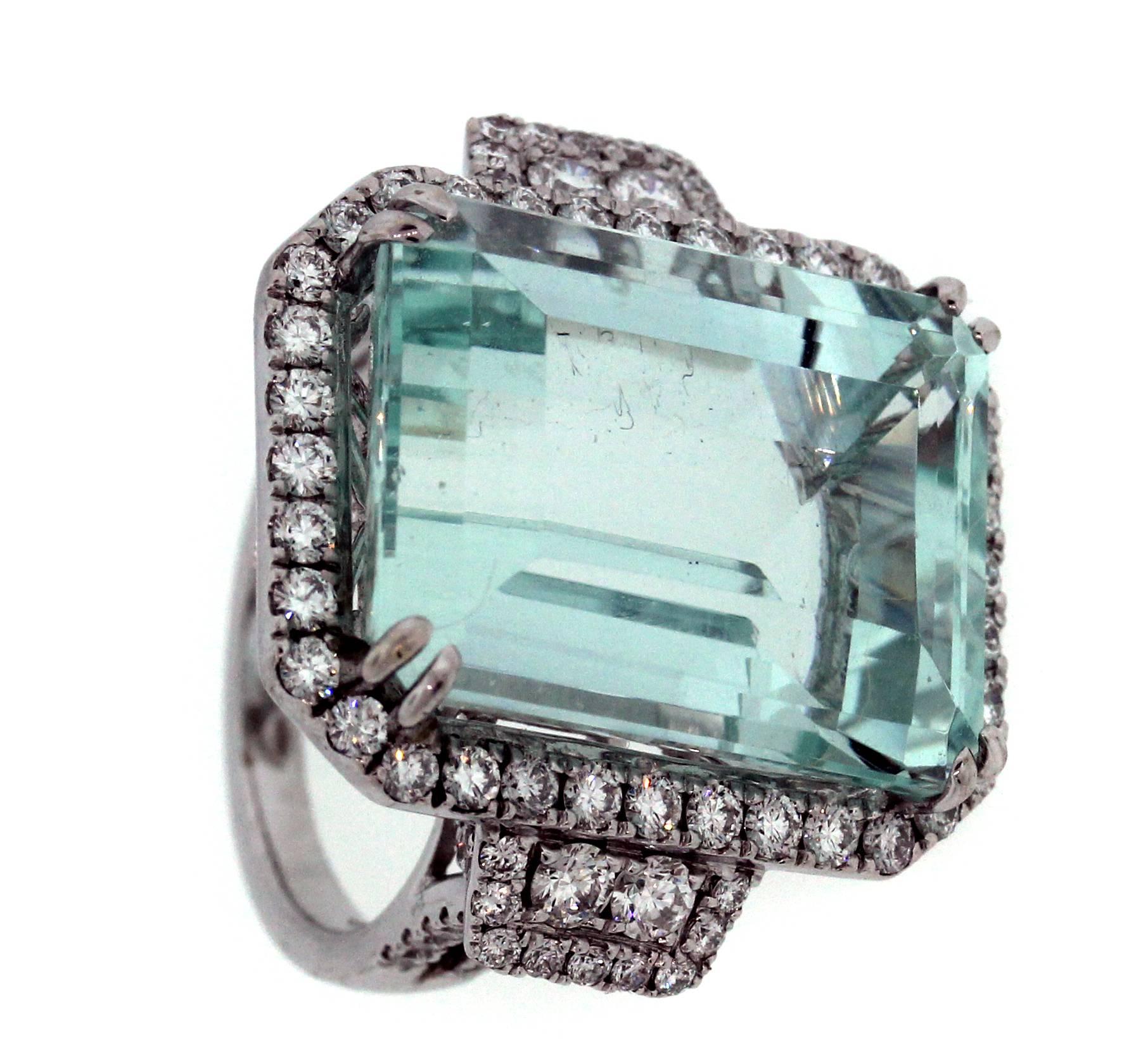18K White Gold Ring with Aquamarine center and Diamonds

23.10 carat center Aquamarine, Emerald Cut, 18mm x 13mm. Stone has slight window, but color is truly incredible. 

2.13 carat G Color, VS Clarity Diamonds

Currently size 5.75. Sizable.