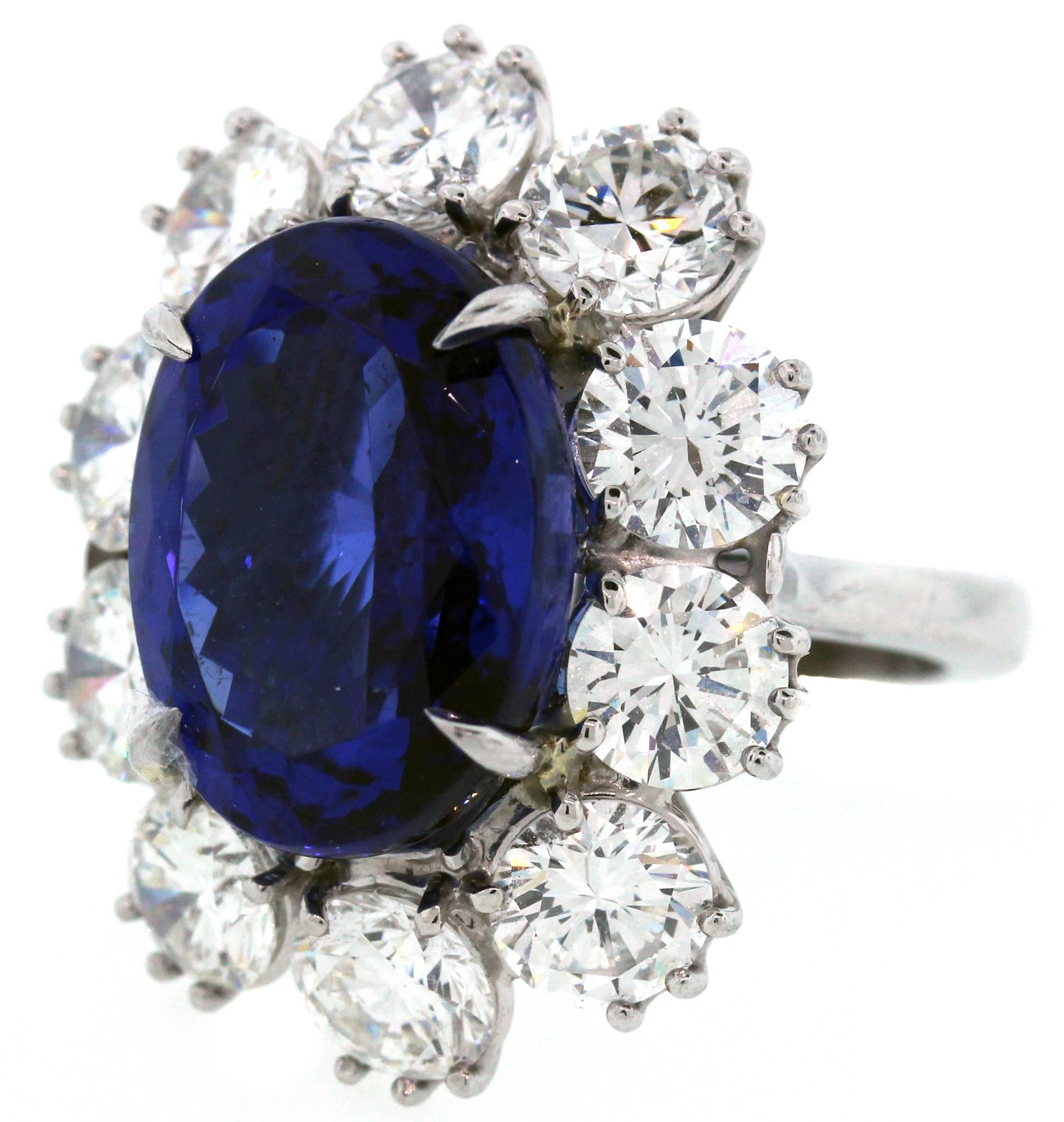 Platinum Ring with Tanzanite Center Surrounded by Diamonds

Tanzanite is oval-cut with incredible color and quality. It is apprx. 12 carats total weight.

Dimensions: 15mm x 11mm

10 Diamonds surround the center stone. Diamonds are each apprx. 0.82