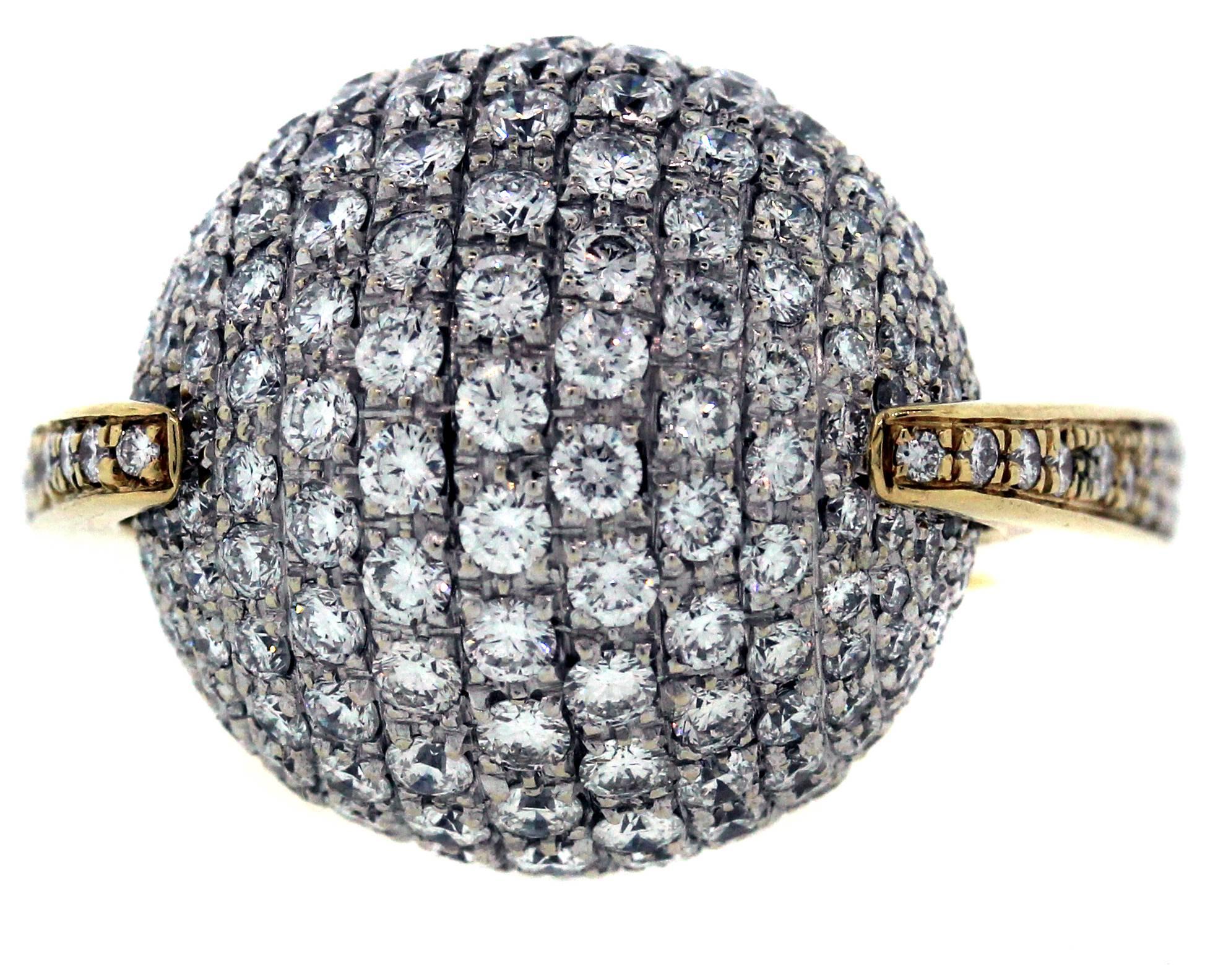 18K Gold Ring with Rotating Diamond Ball Center

The diamonds are set on the band of the ring and on a rotating ball that is truly a unique design element.

7.00ct. apprx F Color, VS Clarity Diamonds total 

The rotating ball is 0.7 inch wide and