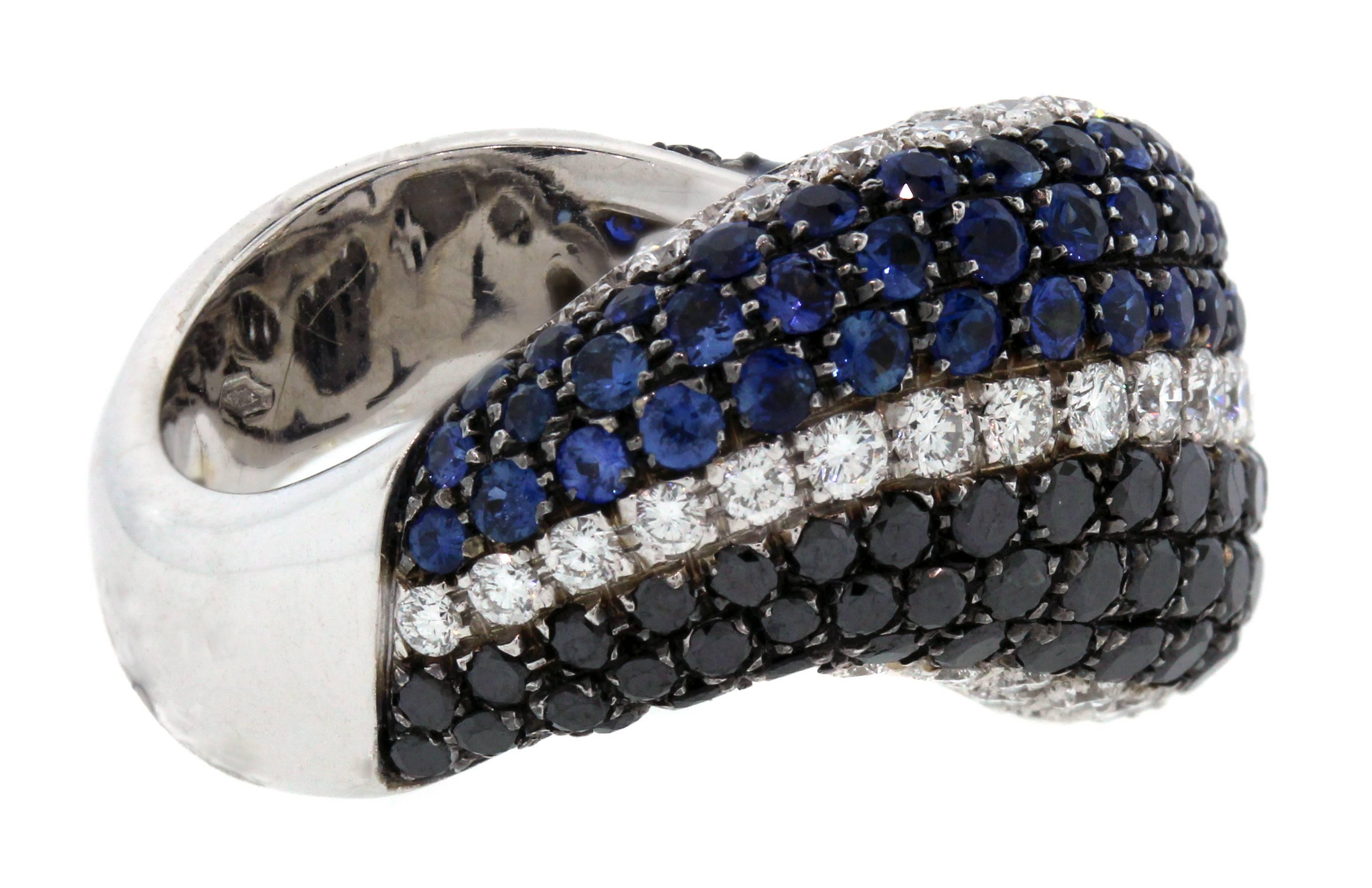 18K Gold Blue Sapphires Black and White Diamonds Curved Angled Band Ring

Gorgeous color combinations put together on this angled band ring.

1.75ct. Black Diamonds are followed by a layer of white diamonds and blue sapphires.

White Diamonds are