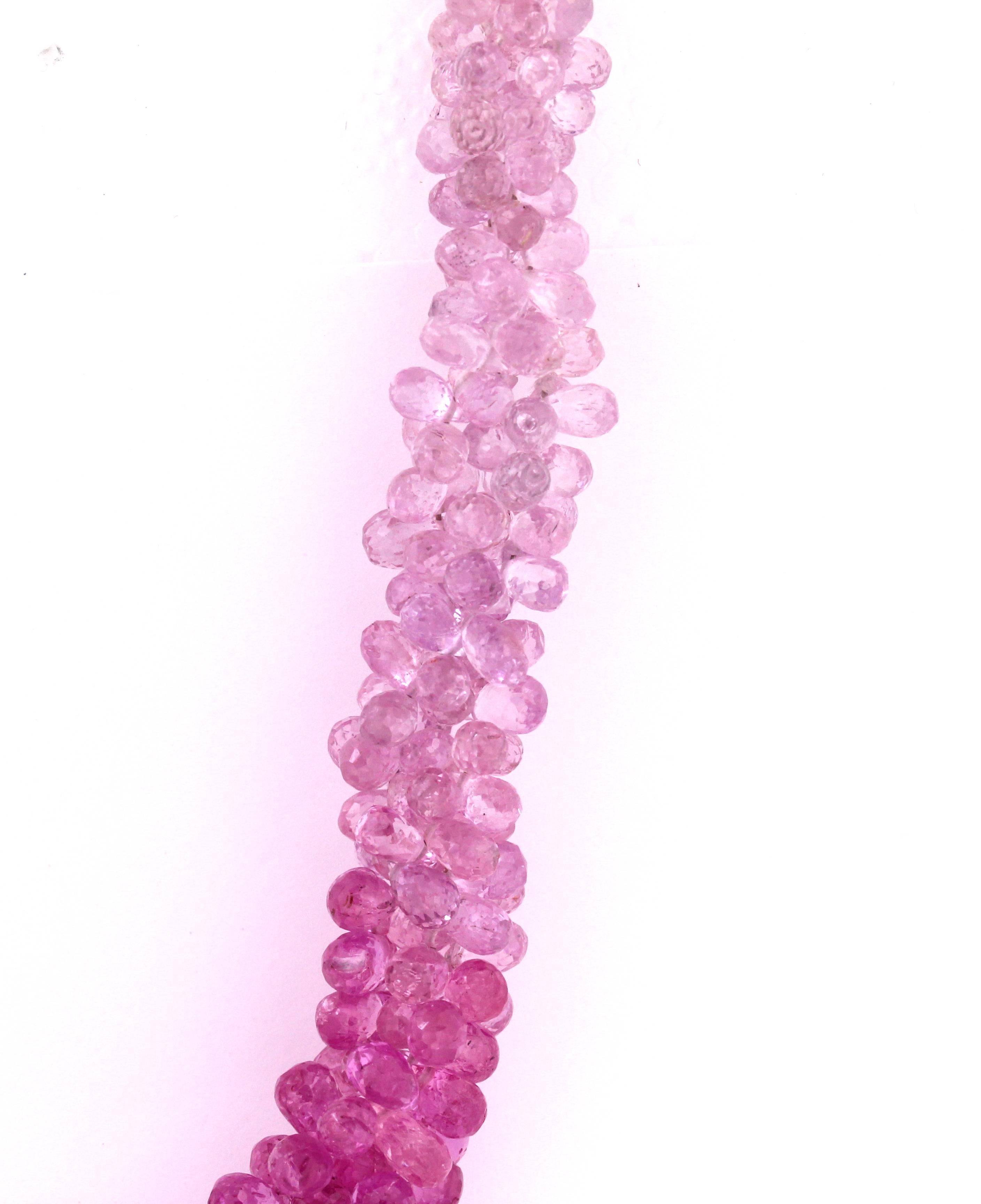 Shaded Pink Sapphire Beads Necklace with 18K Gold clasp Necklace

Pink Sapphires are shaded from light to dark pink in remarkable color coordination.

381.85ct. Pink Sapphires total weight

18K Gold lobster clasp is used 

Necklace is 18 inches in