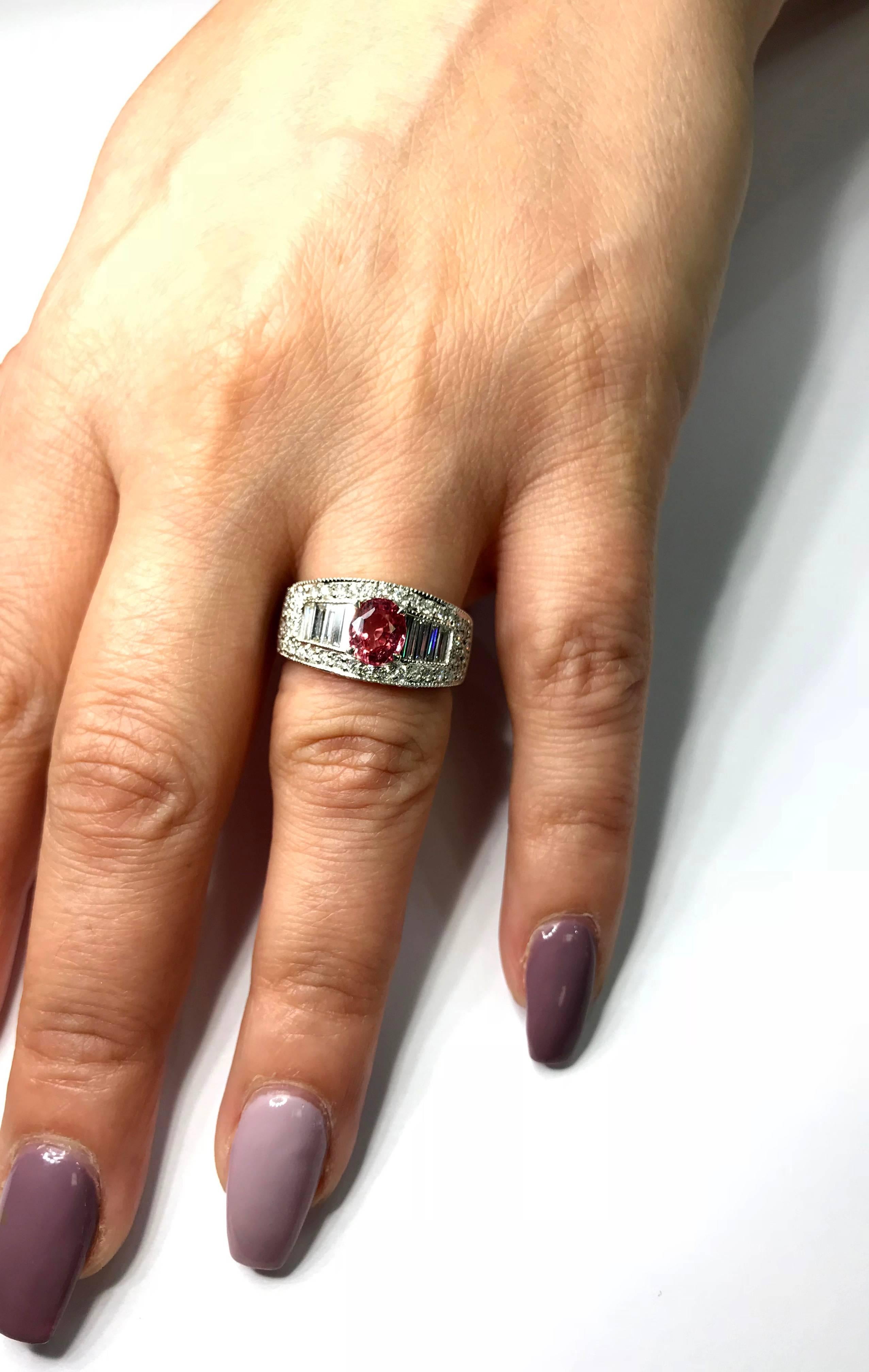 Platinum Ring with GIA Certified 1.25 Carat Padparadscha Sapphire

 Baguette and Round Diamonds set throughout entire ring. All done in Platinum.

Apprx. 0.70ct. Diamonds and apprx. 1.25ct. Baguette Diamonds

GIA Report #: 2258006446. Sapphire has