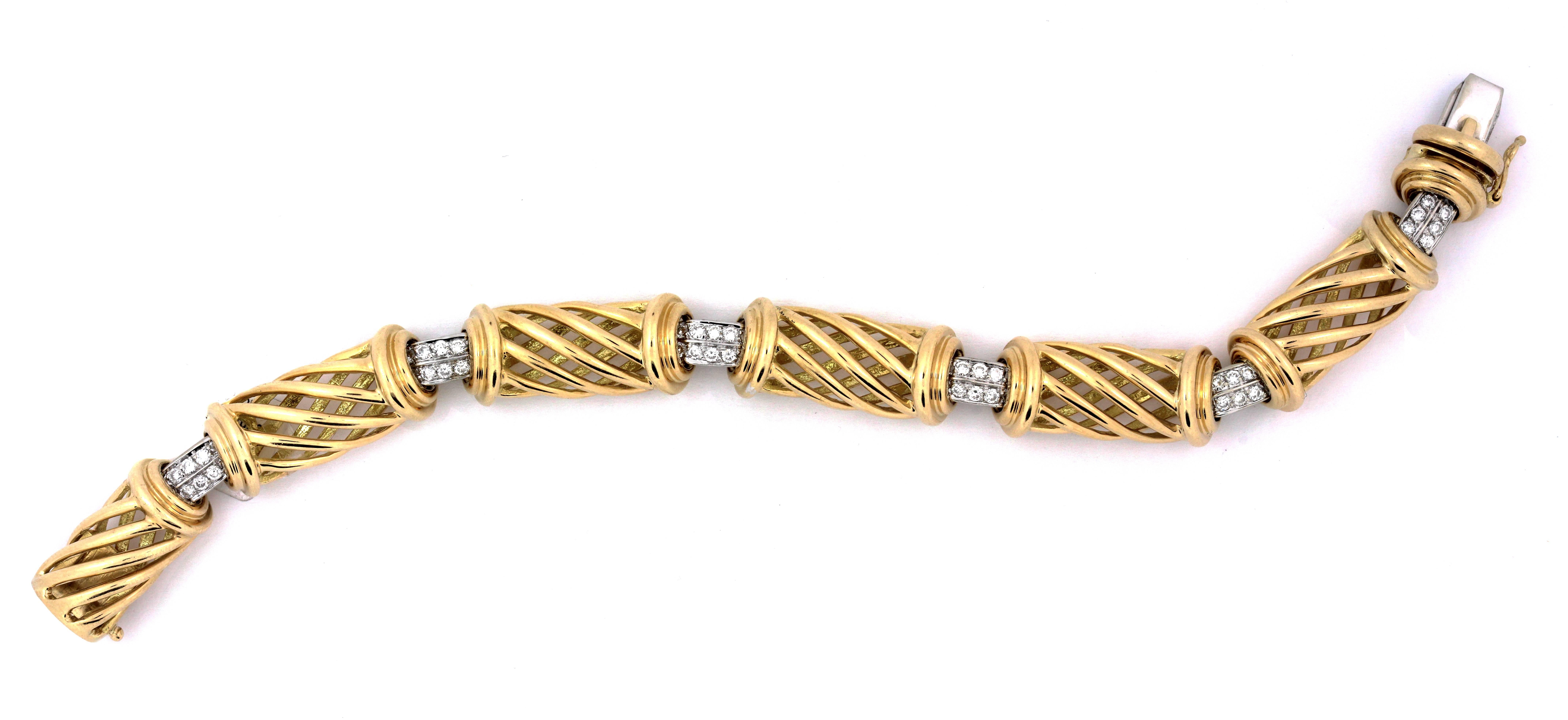 18K Yellow and White Gold Bracelet with Diamonds 

Six diamond sections with weighing 1.80ct. 
All diamonds are G Color VS Clarity

Stunning design work on bracelet, all links have a 3D like feel.

Bracelet is 7 inches in length, 0.4 inch