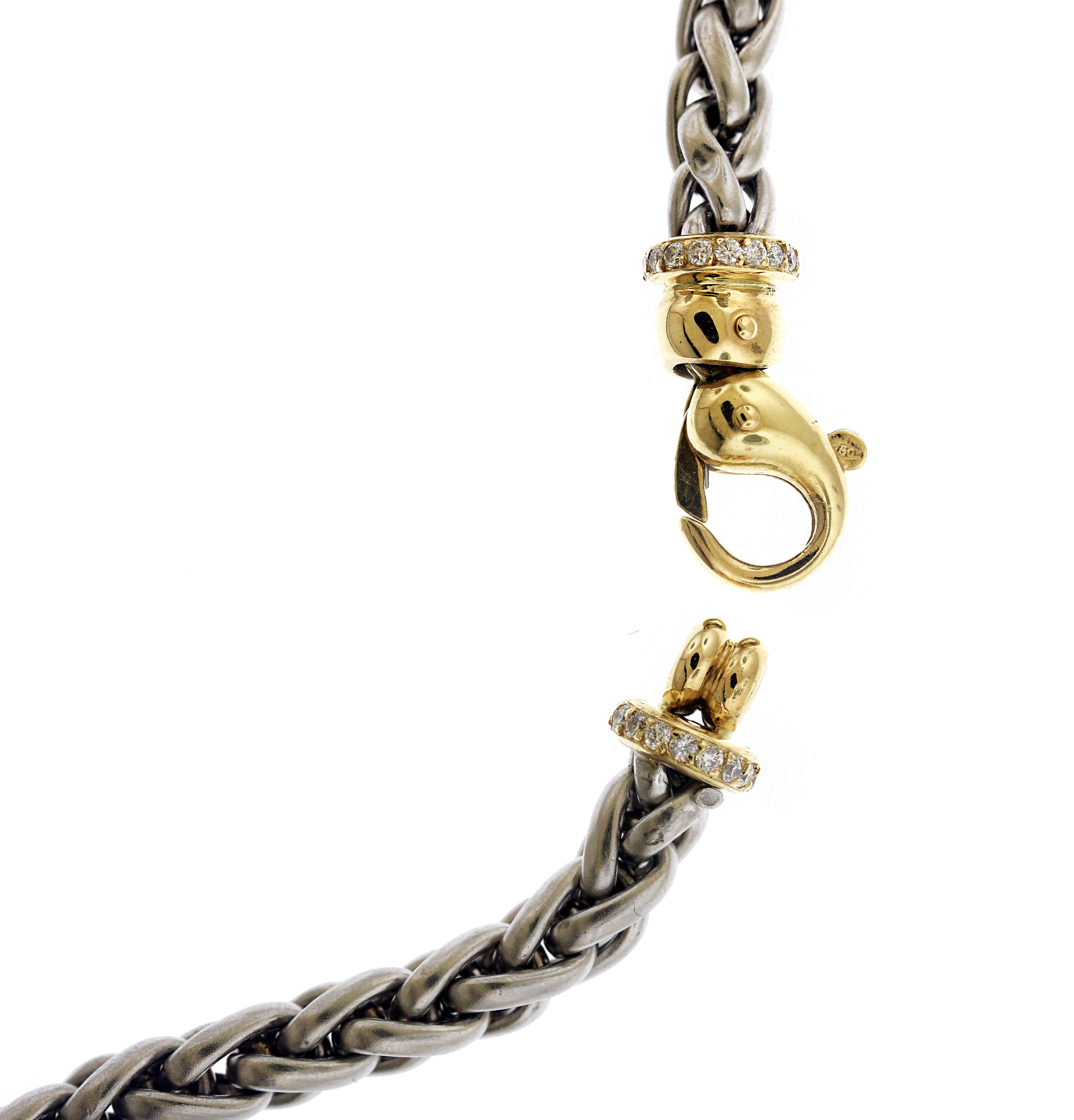 Platinum and 18K Yellow Gold Chain Necklace with Diamond Lobster Clasp

Three diamond links are present set in 18K yellow gold. 

Necklace is 16 inches in length. 0.3 inch width.

Lobster clasp is meant to be shown on the side rather than the back