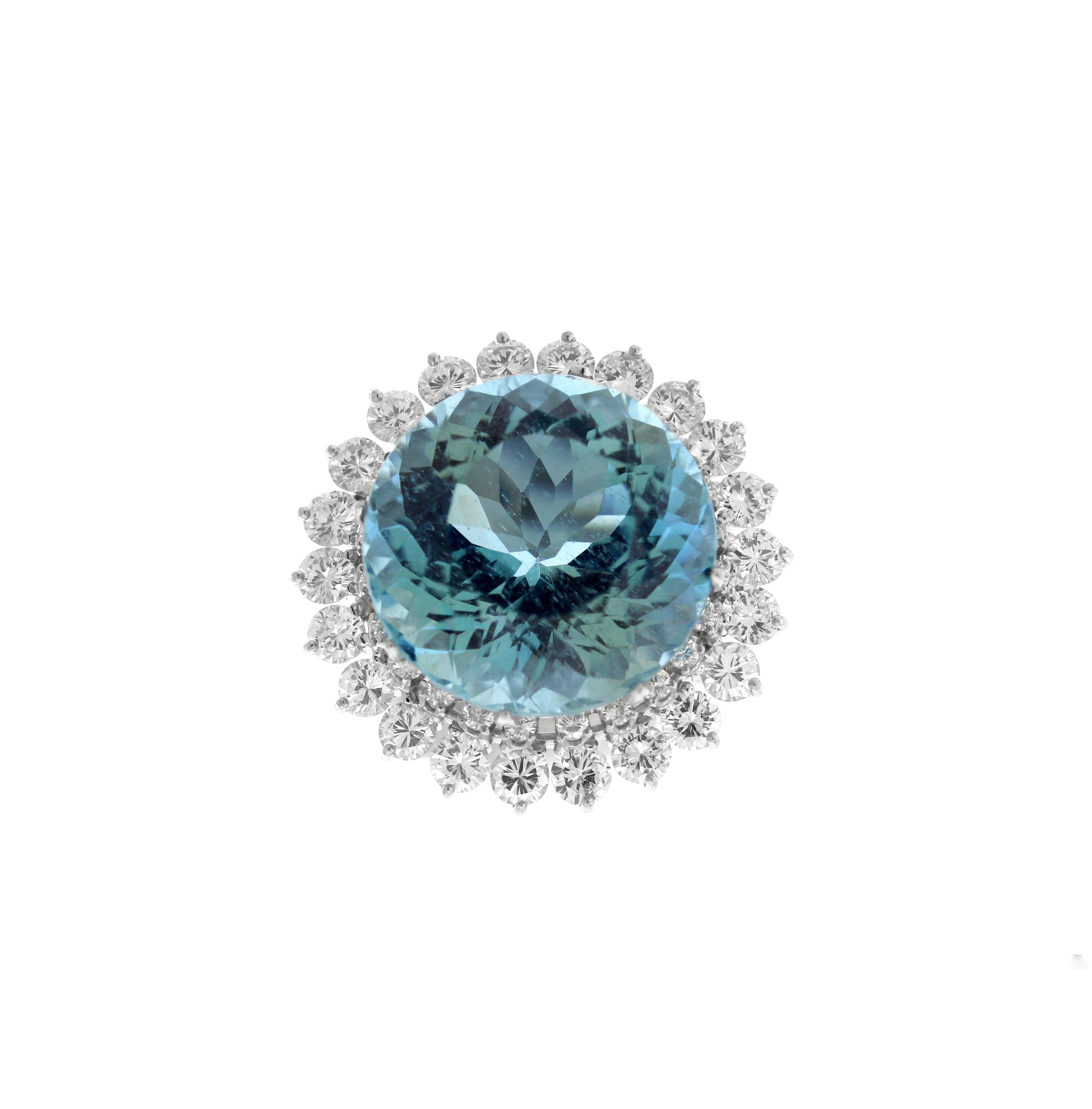 Platinum Ring with Aquamarine Center and Diamonds

35 carat apprx. Aquamarine center in vibrant color and clarity. Aquamarine has a lot of life and is truly exceptional

7.50 carat G color, VS clarity 

Diamonds are set around the stone and