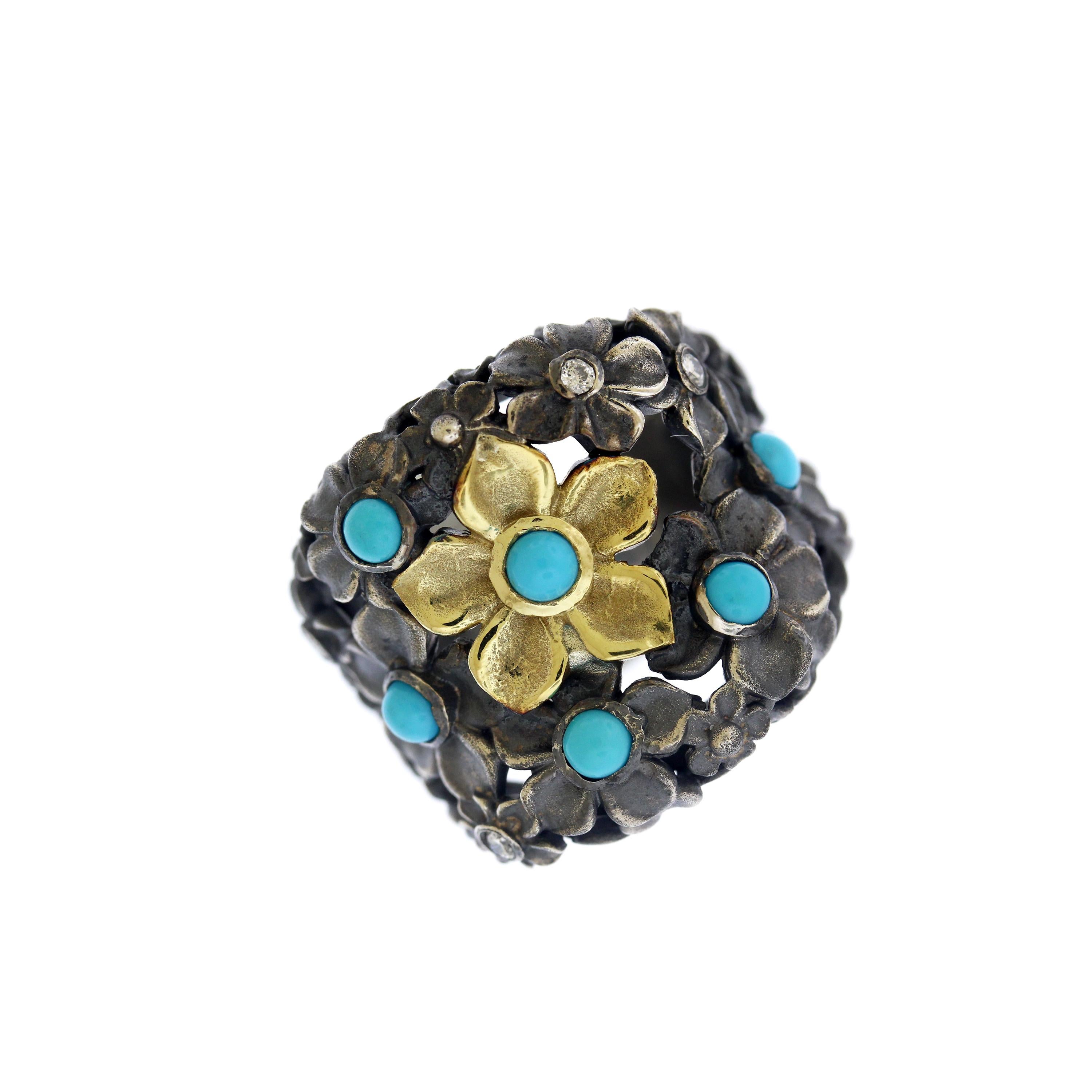 Stambolian Aged Silver & 18K Yellow Gold Flower Ring with Sleeping Beauty Turquoise. 

18K Yellow Gold Center Flower and Aged Silver Flowers all around.

0.14 carat diamonds.

2 carat approximate round Sleeping Beauty Turquoise.

Ring face is 0.9